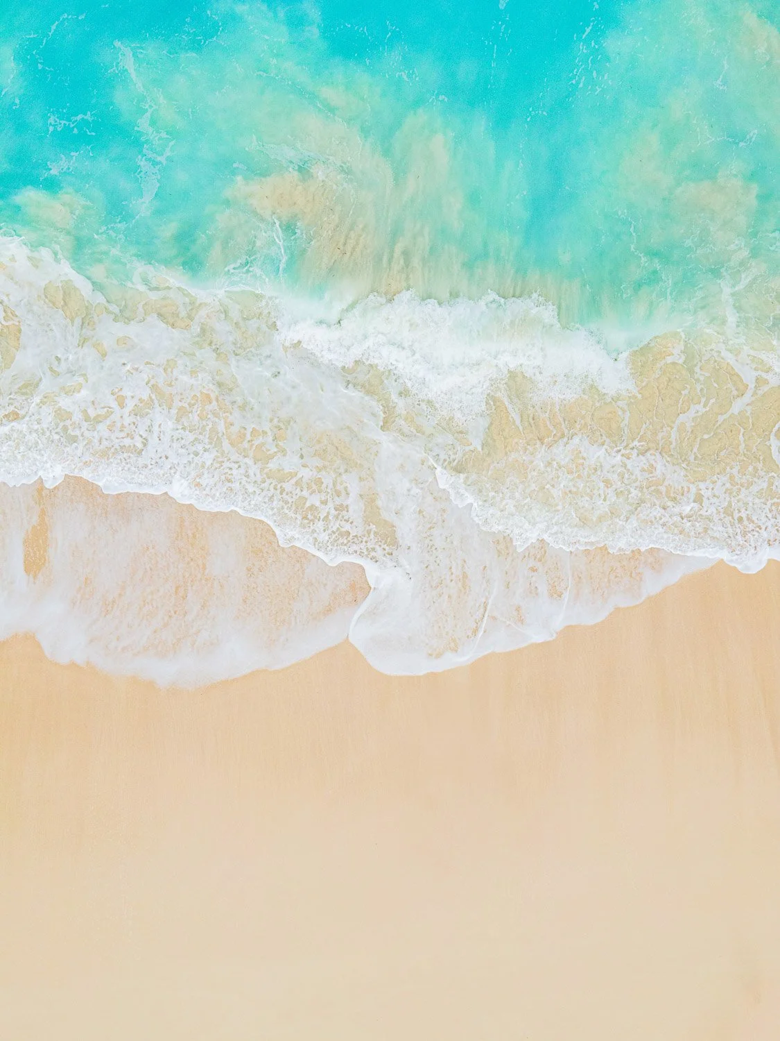 really blue waves on tropical beach - drone photography how to