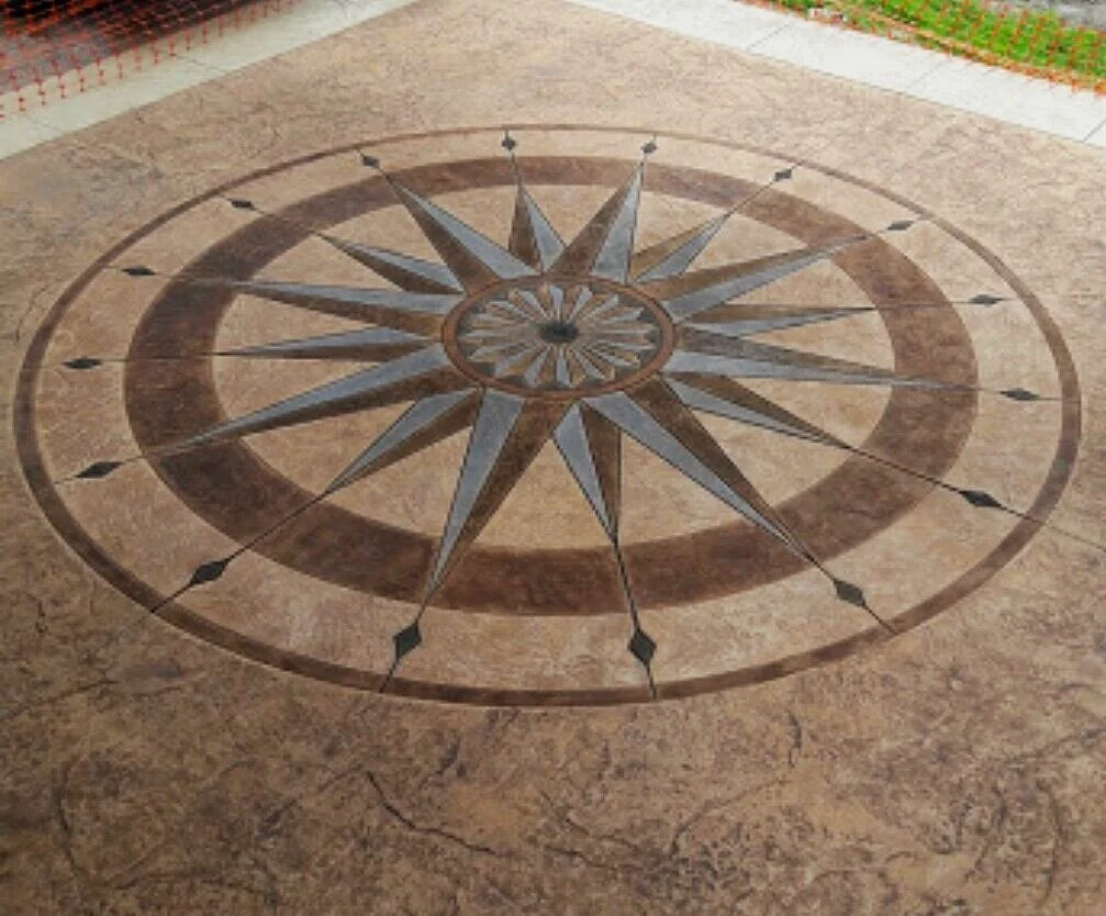 Concrete surface with decorative compass rose design