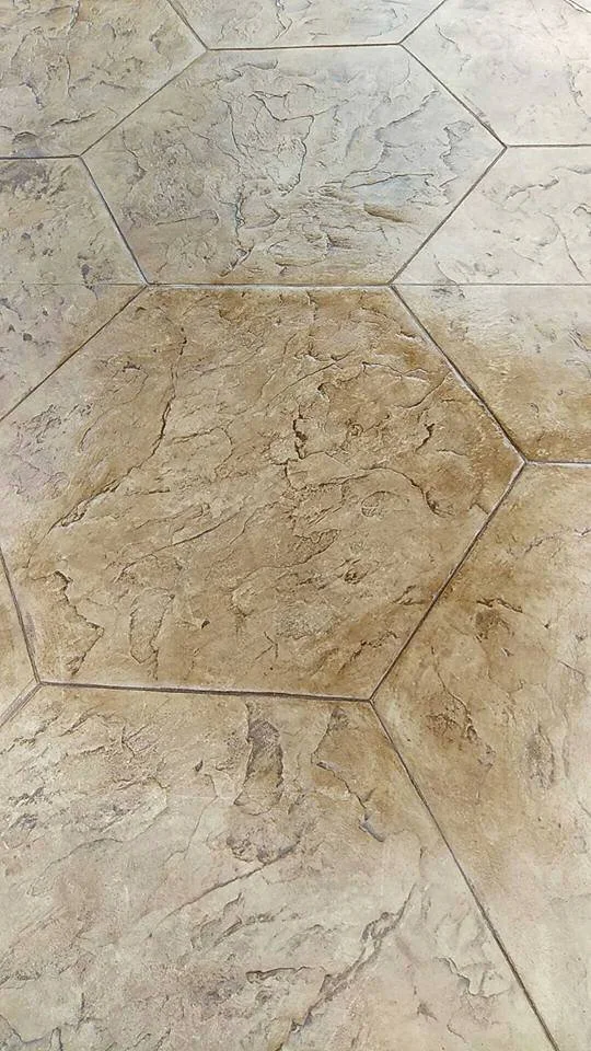 Hexagonal stone stamped concrete with colored, decorative textured surface