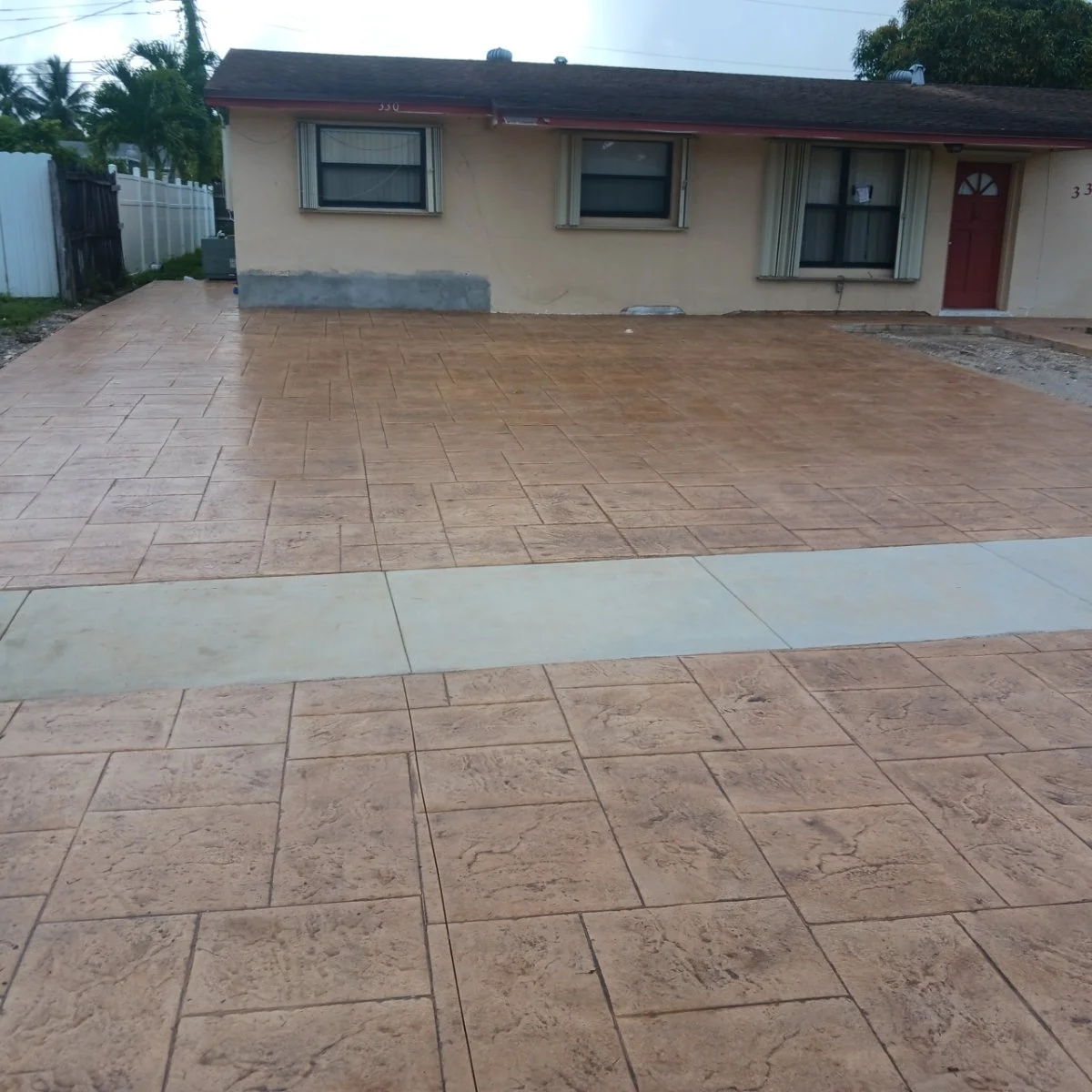 House with stamped concrete driveway