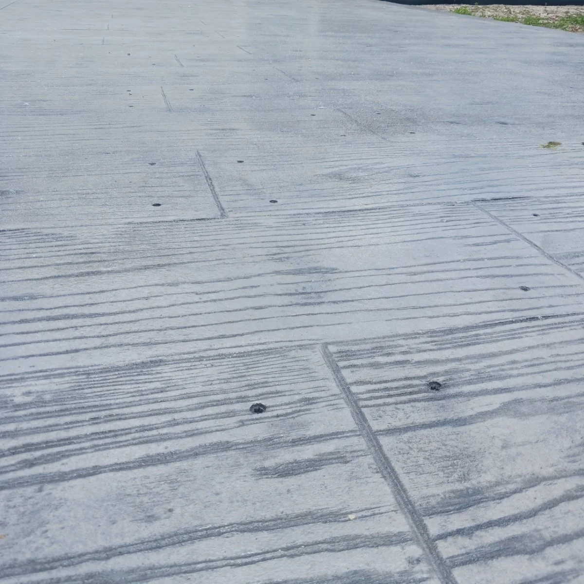 Patterned concrete pavement with wood grain texture