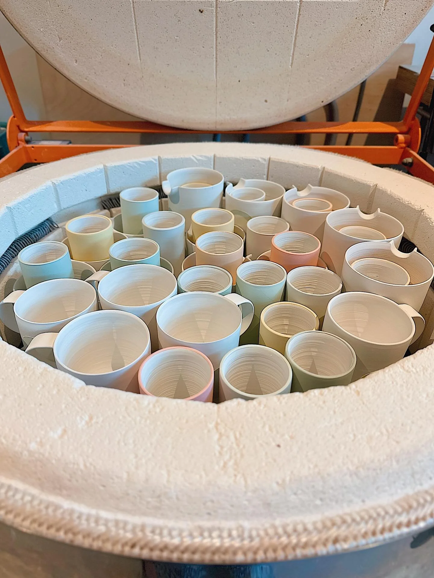 A satisfyingly tightly full packed  bisc (first) firing from top to bottom : &gt; ) I could have got some more mini vases inside the mugs on the middle shelf if I had them, but pretty pleased with that! : D 
.
.
.
.
#handmade #wheelthrown #porcelain 