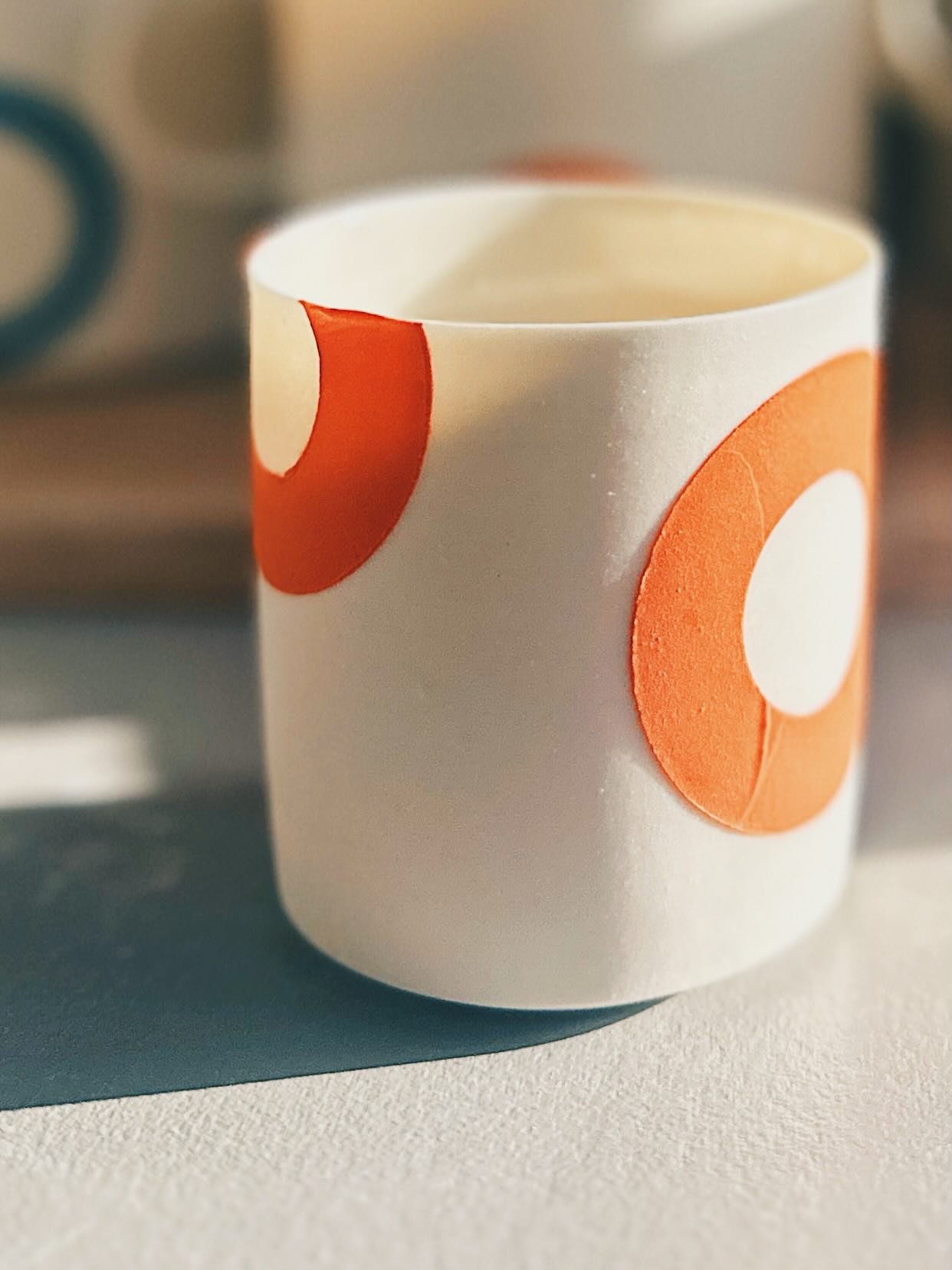 A little experiment just out of the kiln&hellip; I love how the strong early morning sunlight is highlighting the translucent porcelain and picking out the raised tactile stencilled slip circles&hellip;Thinking of trying this out on some espresso cup