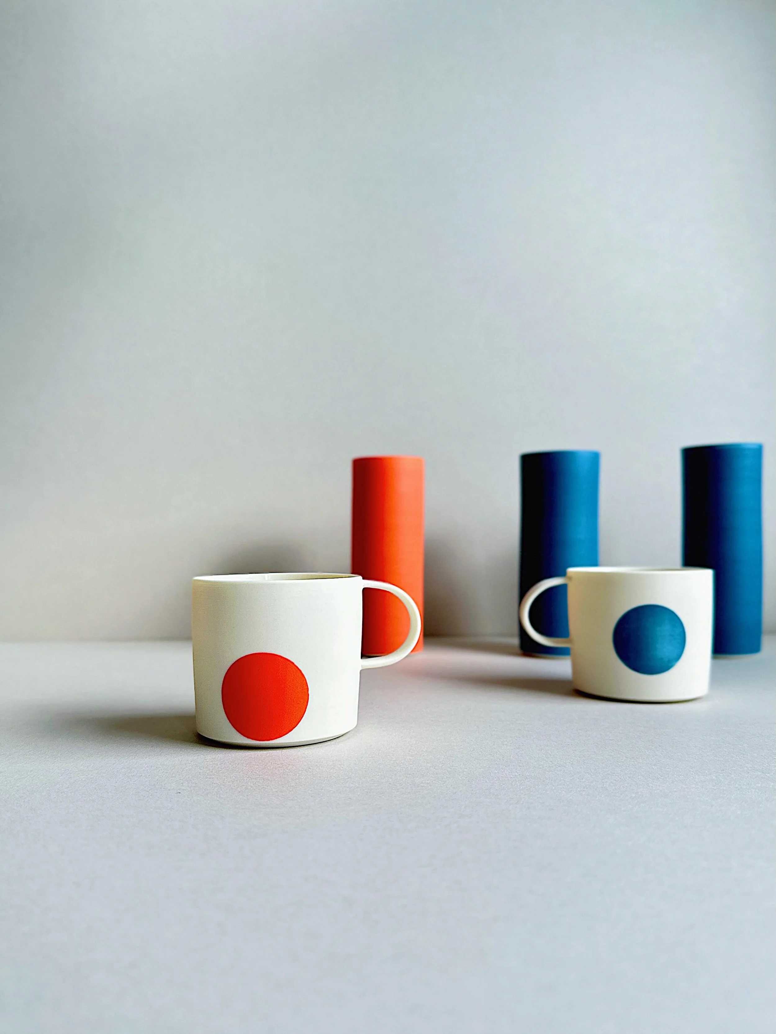 Red, blue, yellow and orange slip dotted espressos and cylinders&hellip; 4 out of 7, over half a rainbow : D 
.
.
.
.
.
 #wheelthrown #porcelain #studiopottery #contemporaryceramics #carshaltonartists