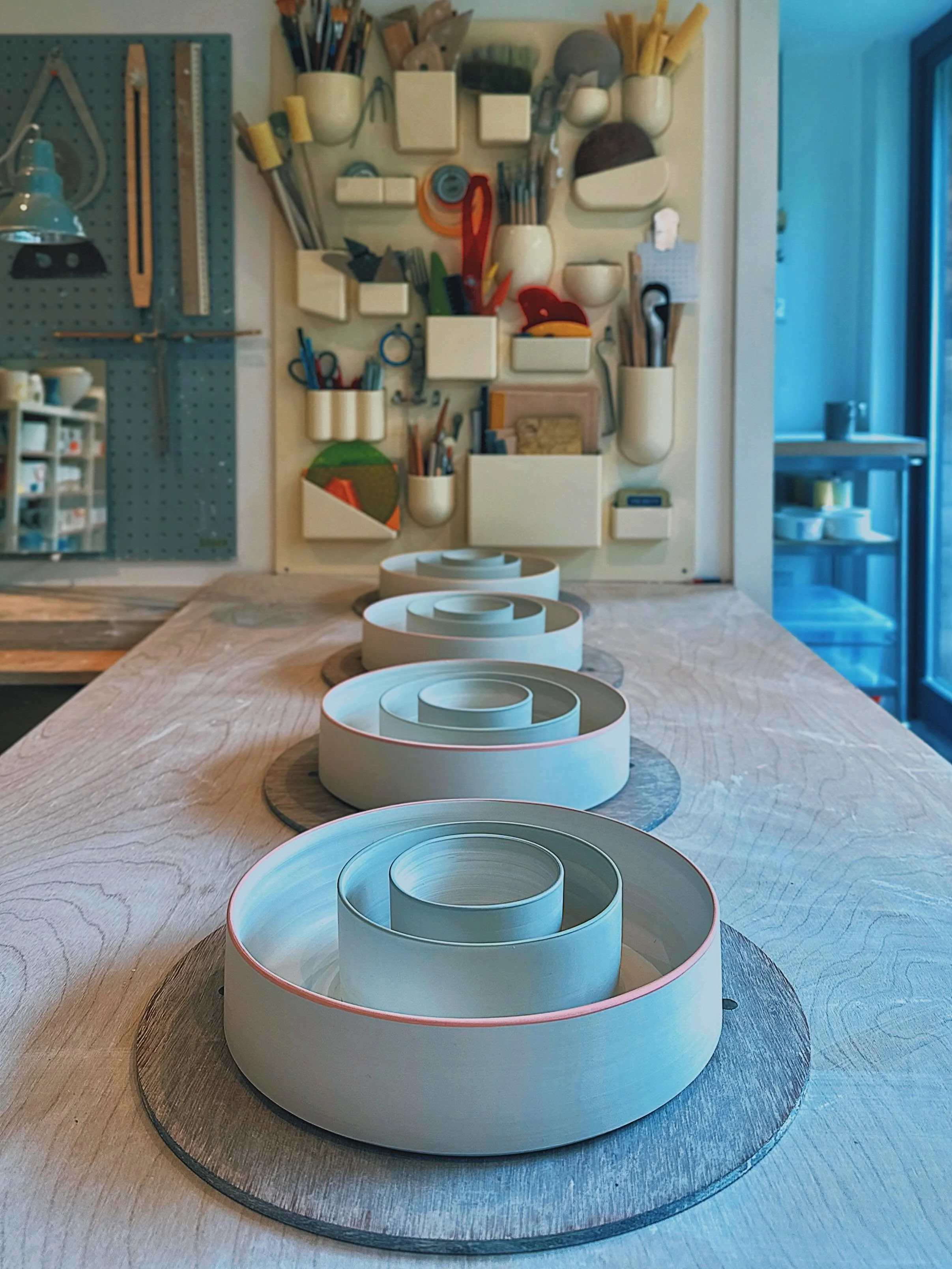 Work in progress&hellip; three dish nests&hellip; thrown, turned, coloured slip rims added&hellip; slowly drying now before their first bisc firing&hellip;
.
.
.
.
.
 #wheelthrown #porcelain #studiopottery #carshaltonartists #openstudios