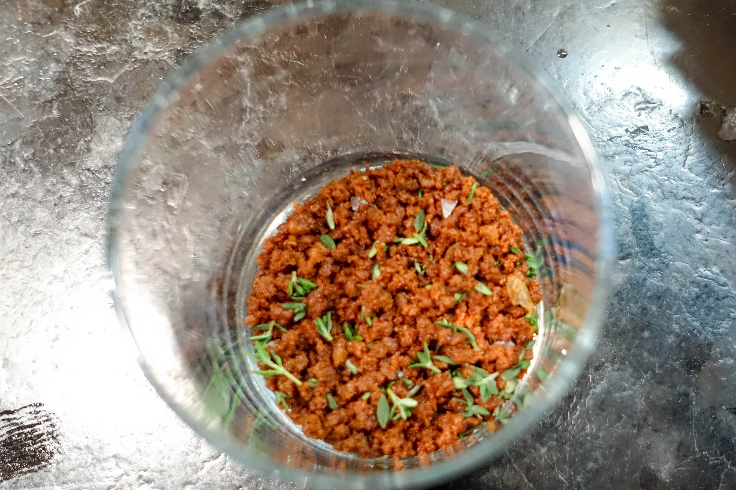 The finished product; crispy duck skin crumble to which a little thyme has been added.