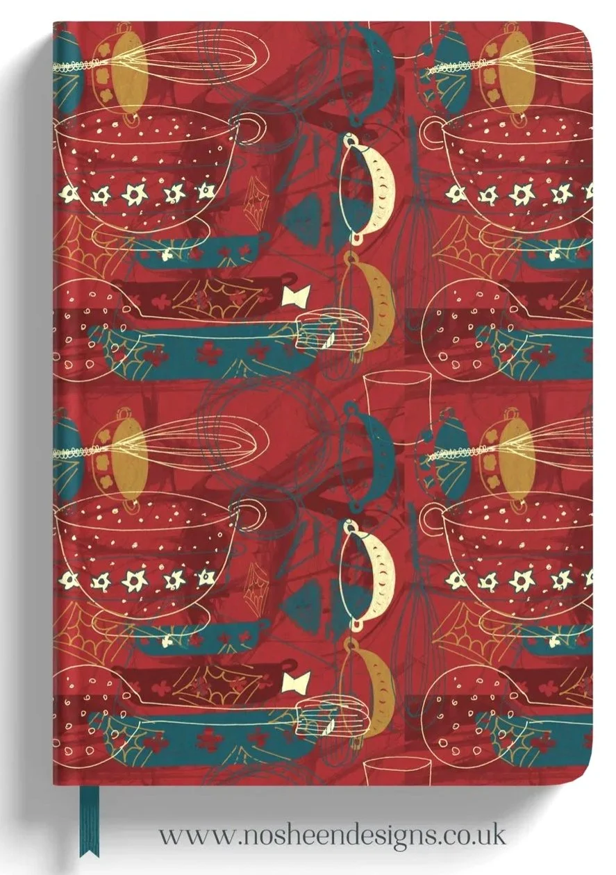 Holiday-themed notebook cover with illustrations of mugs, candles, hats, and spider webs on a red background.