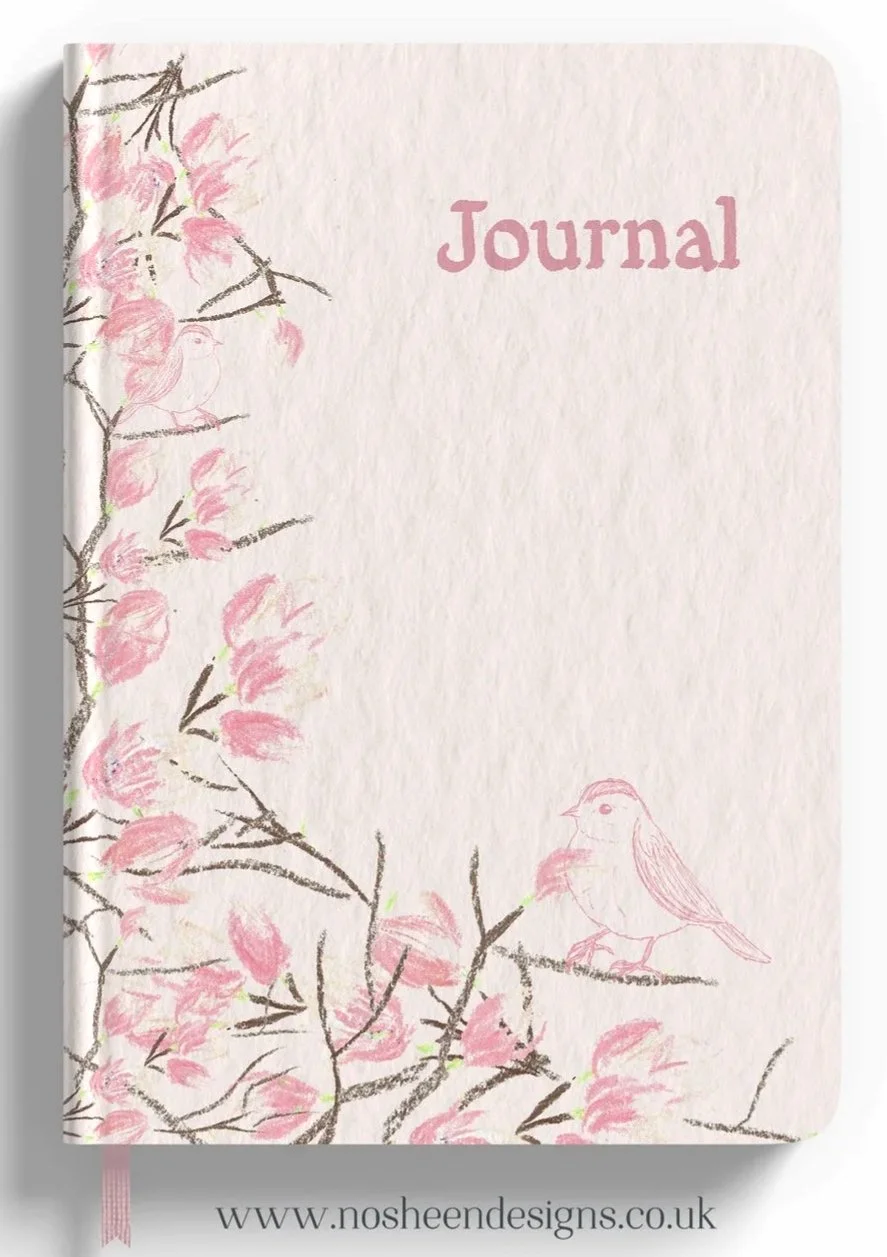 A pink and white journal cover with an illustration of cherry blossoms and two small birds on branches, and the word 'Journal' written in pink.