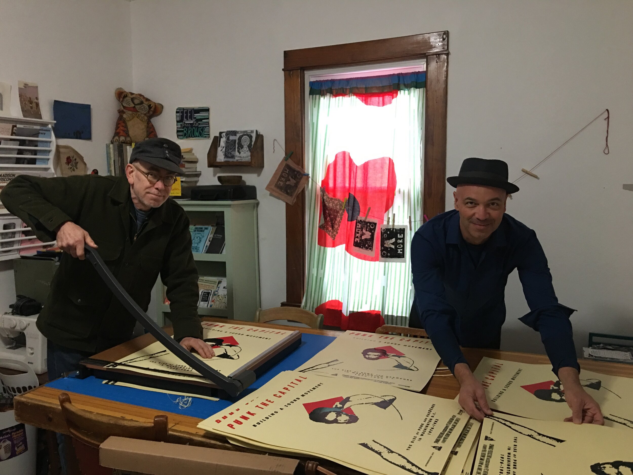  Jeff Nelson and James June Schneider, cutting posters on the road. 