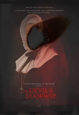 A nun in a white habit stands facing the viewer - it looks like a photograph with a burn/smudge where the face is. (Poster for The Devil's Doorway)