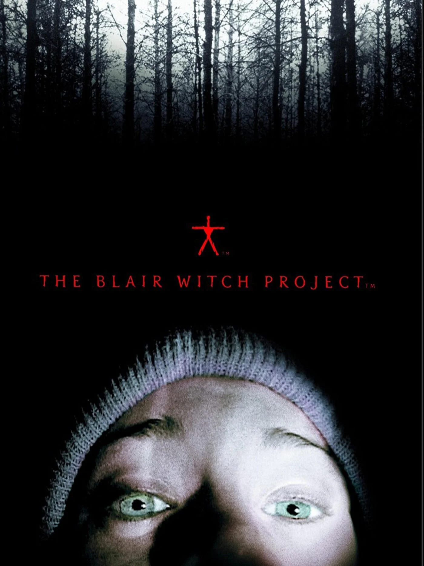Poster, showing film title in red in the centre. Woods in the background. Foreground: a woman's face, upset, head tilted back, visible from nose upwards. She wears a beanie hat.