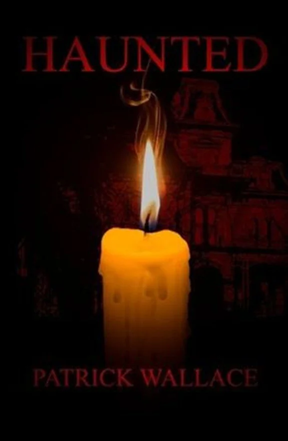 Book cover for Haunted. Book title in red at the top, author's name (Patrick Wallace) in same font at bottom. The background is a barely visible house, while the foreground shows a lit candle.