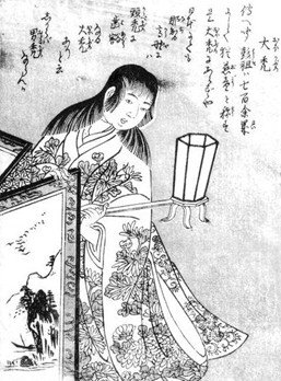 An ōkaburo holds a lamp. Japanese writing is across the top of the image, and the ōkaburo seems to be leaning on a decorated table. Their kimono is illustrated with flowers.