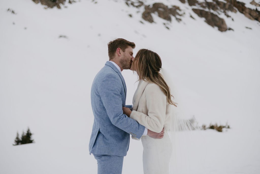 Newlyweds put their wedding apparel on once more to exchange private vows at Loveland Pass, following their surprise wedding in Colorado Springs.