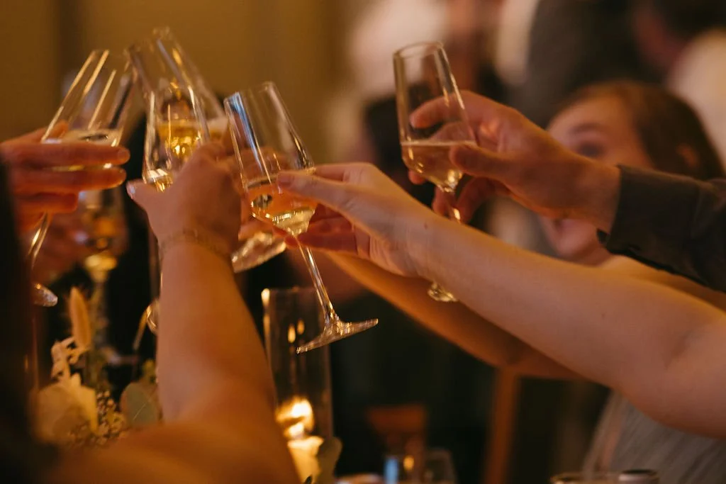 Guests toast their wine glasses during a wedding reception at Toiyabe Golf Course.