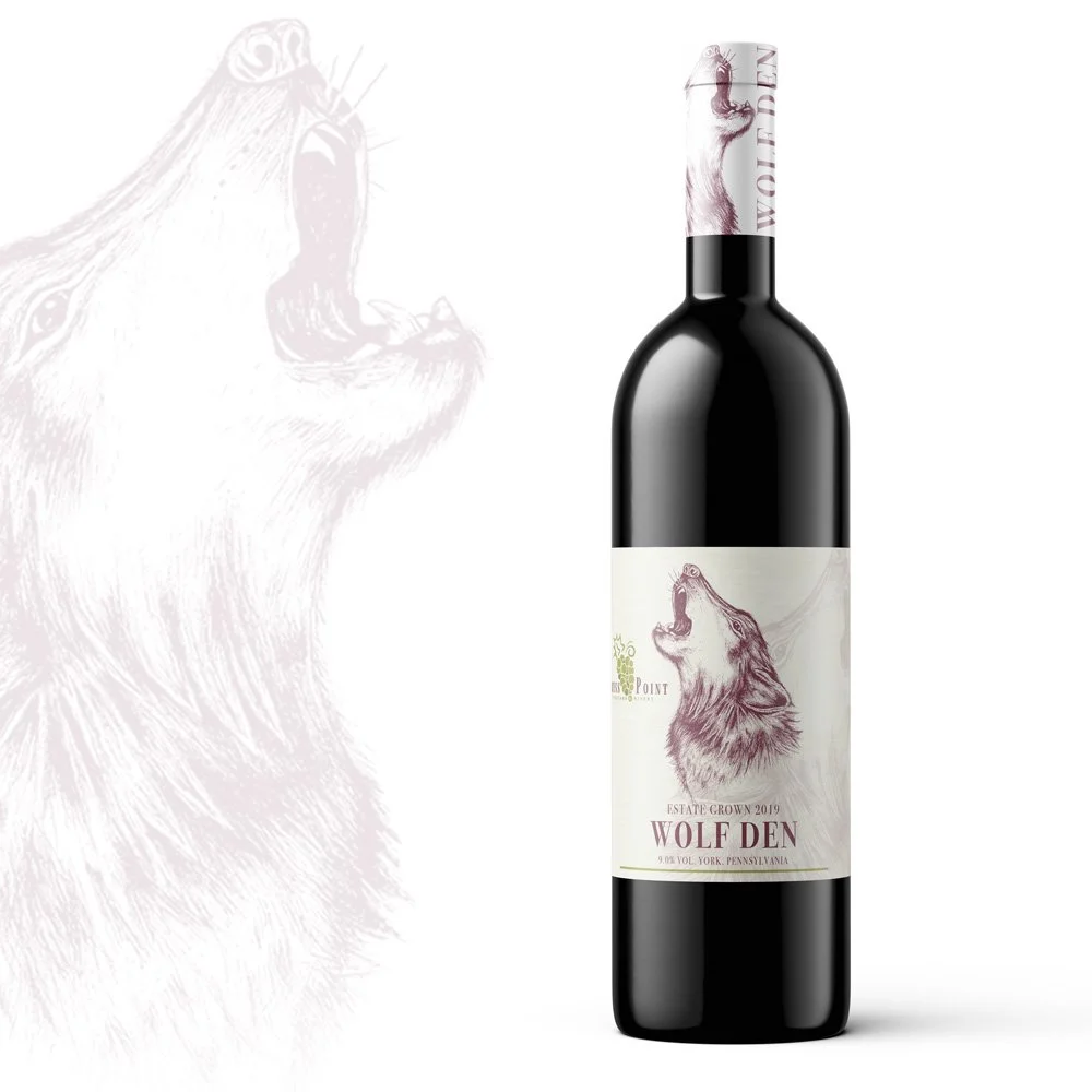 Wine bottle label design with a hand drawn illustration of a wolf howling. 