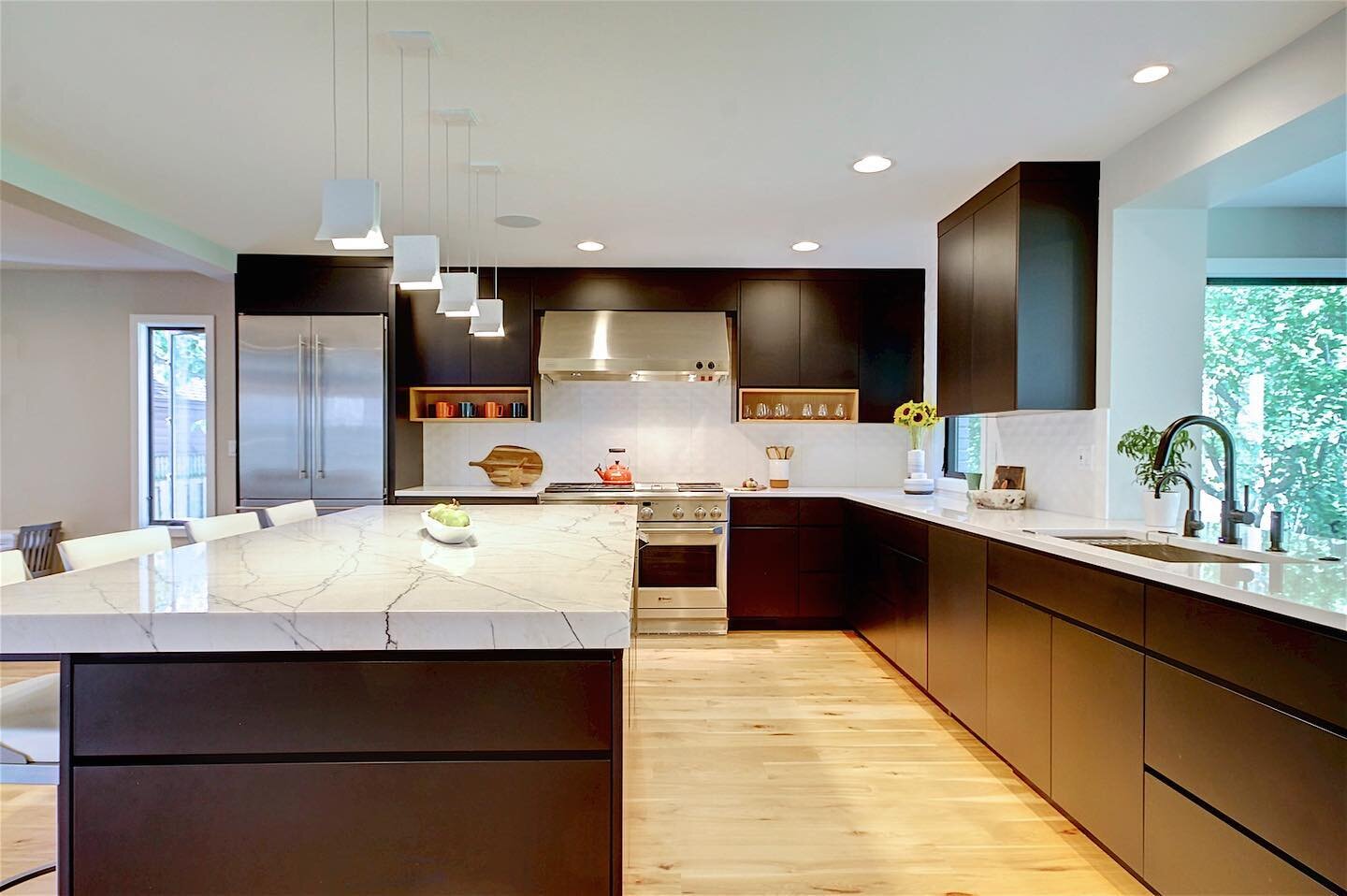 This modern kitchen is the cherry on top of a very cool dwell-inspired home renovation!