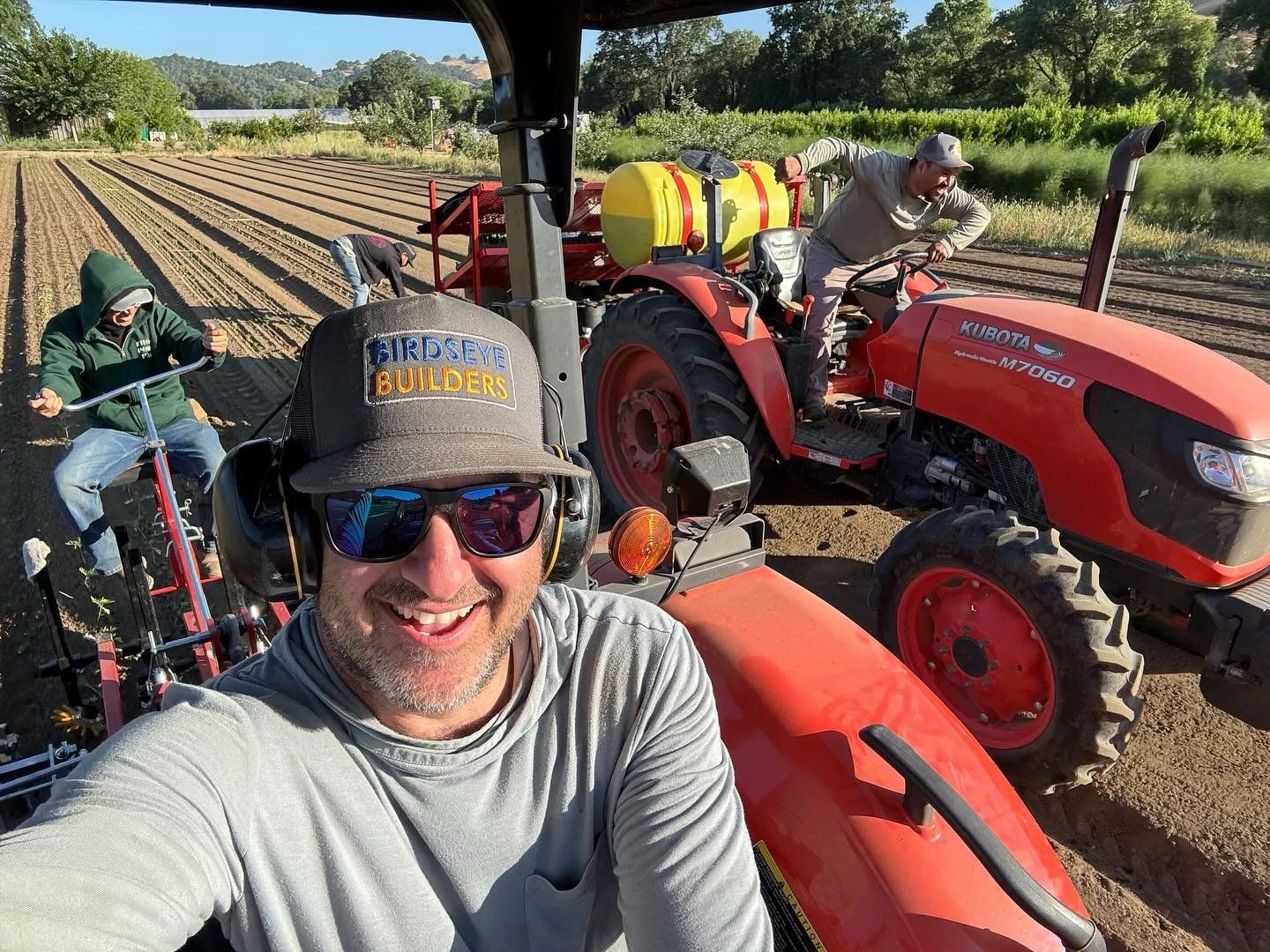 On the farm at @frontporchfarmer! Allstar tractor crew, planting squash and tomato plants sizing up for summer harvesting! Your local farmers are working hard to grow all the things you love to eat this season.