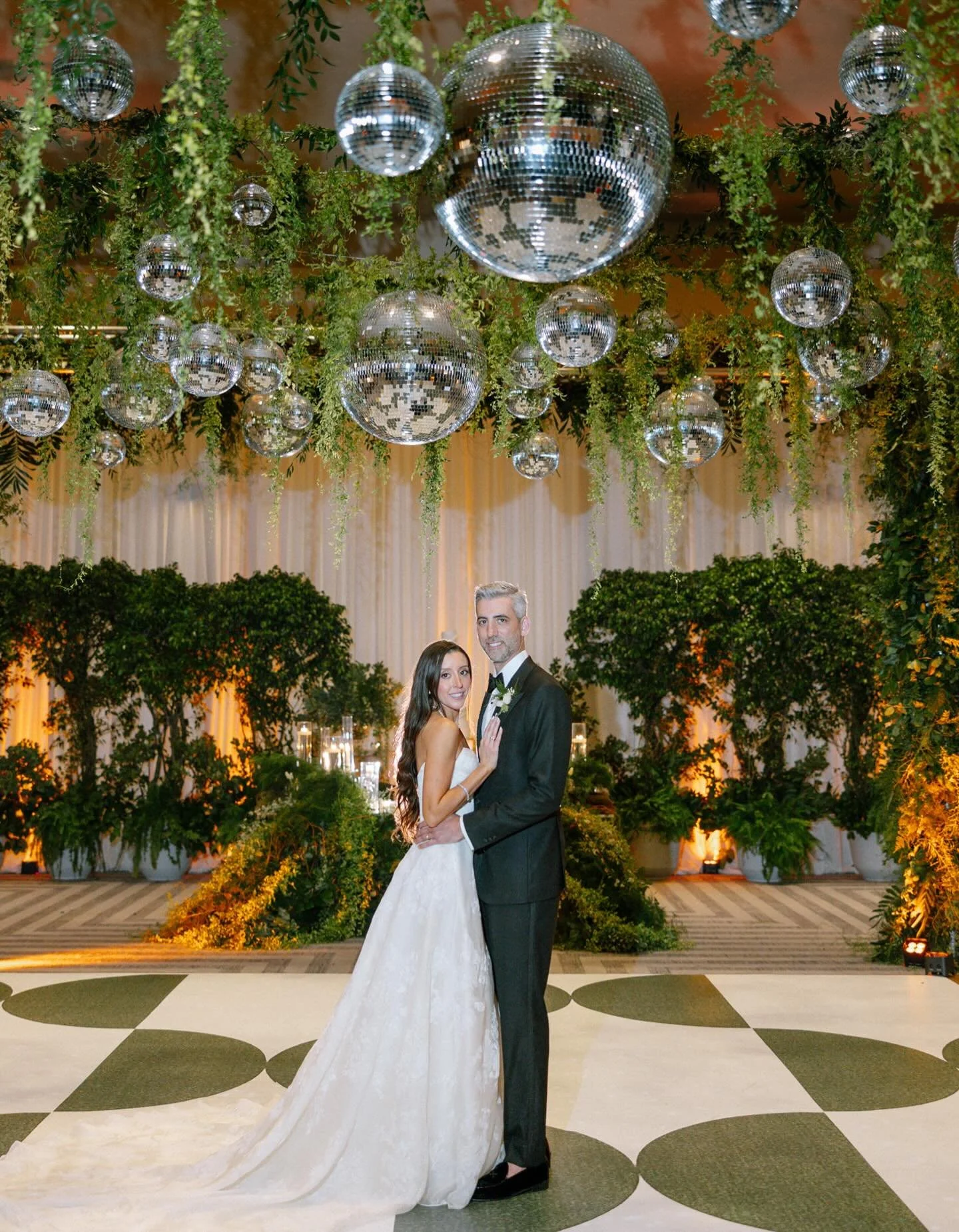 Every wedding begins with a vision.

For this celebration, we wanted the space to feel alive &mdash; a dance floor framed by cascading greenery and mirror balls reflecting every light, every movement, and every moment of joy.

Design is not just abou