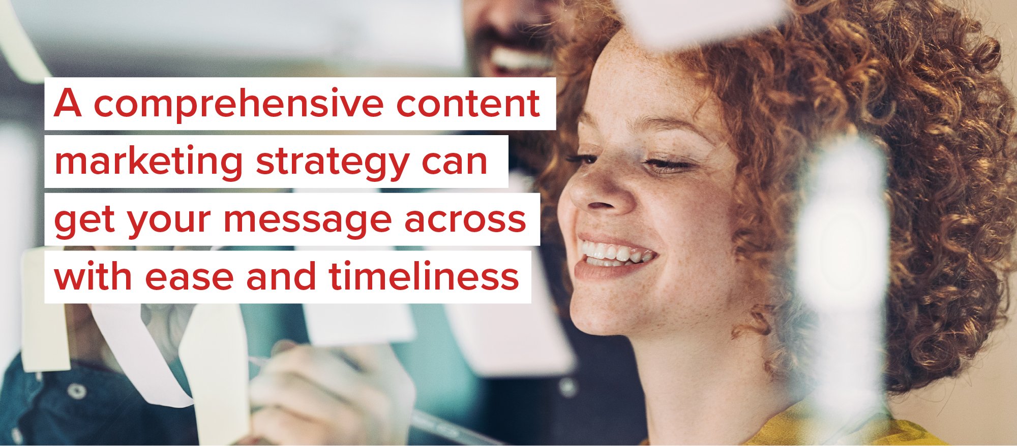 A comprehensive content marketing strategy can get your message across with ease and timeliness. Image of woman holding pencil