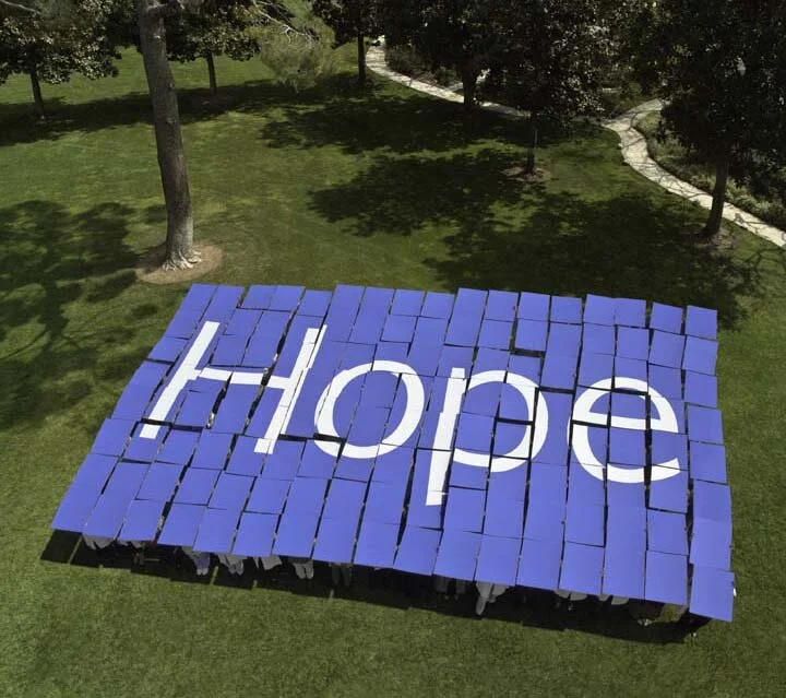  City of Hope City of Hope centennial choreographed staff holding cards displaying “Hope” 