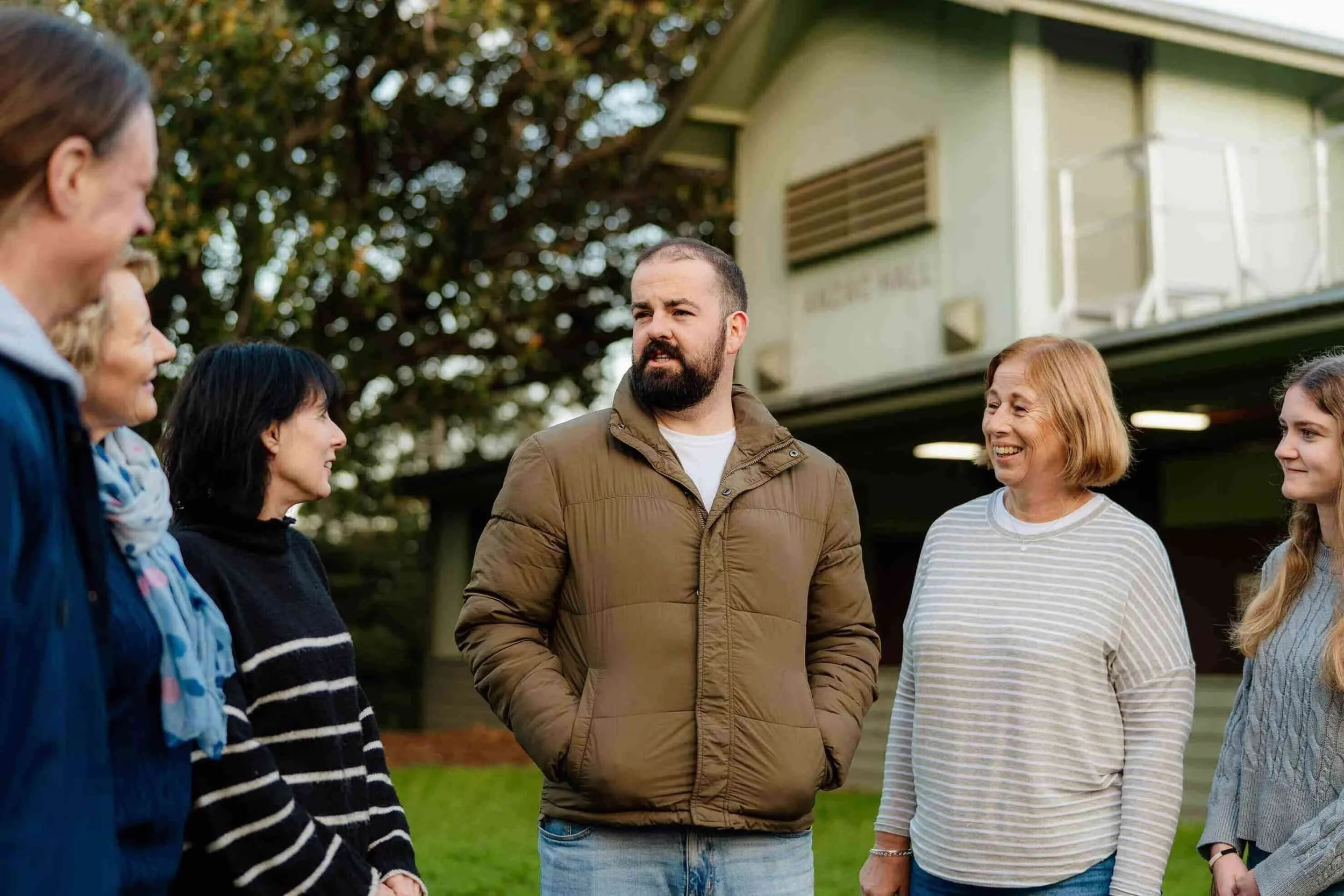 Adults outside urban camp