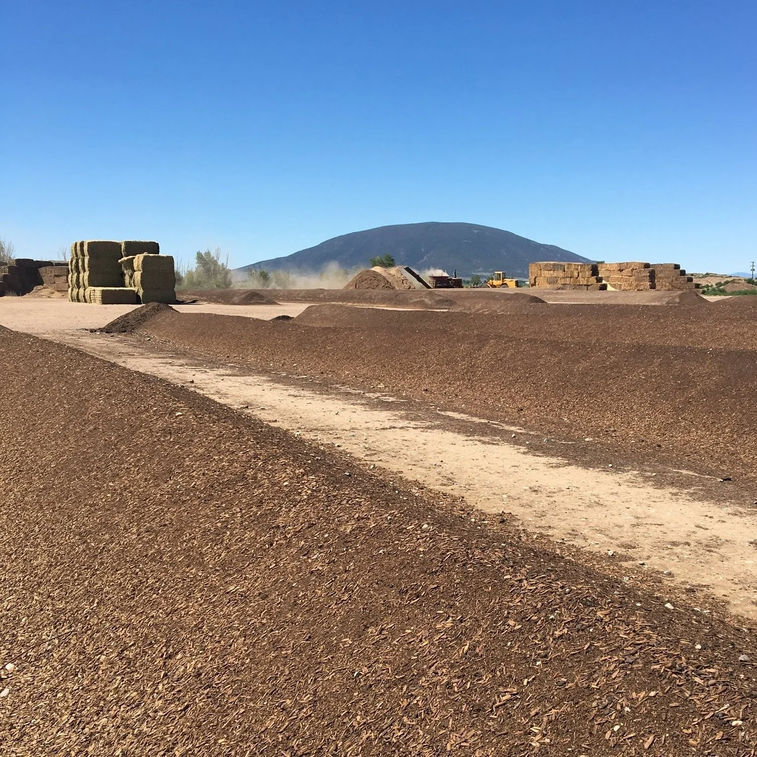 Commercial compost is typically made using the windrow method, where water is mixed with wood chips and straw, then mechanically turned. The process uses a lot of diesel fuel, and the compost has a low microbial and fungal content.
