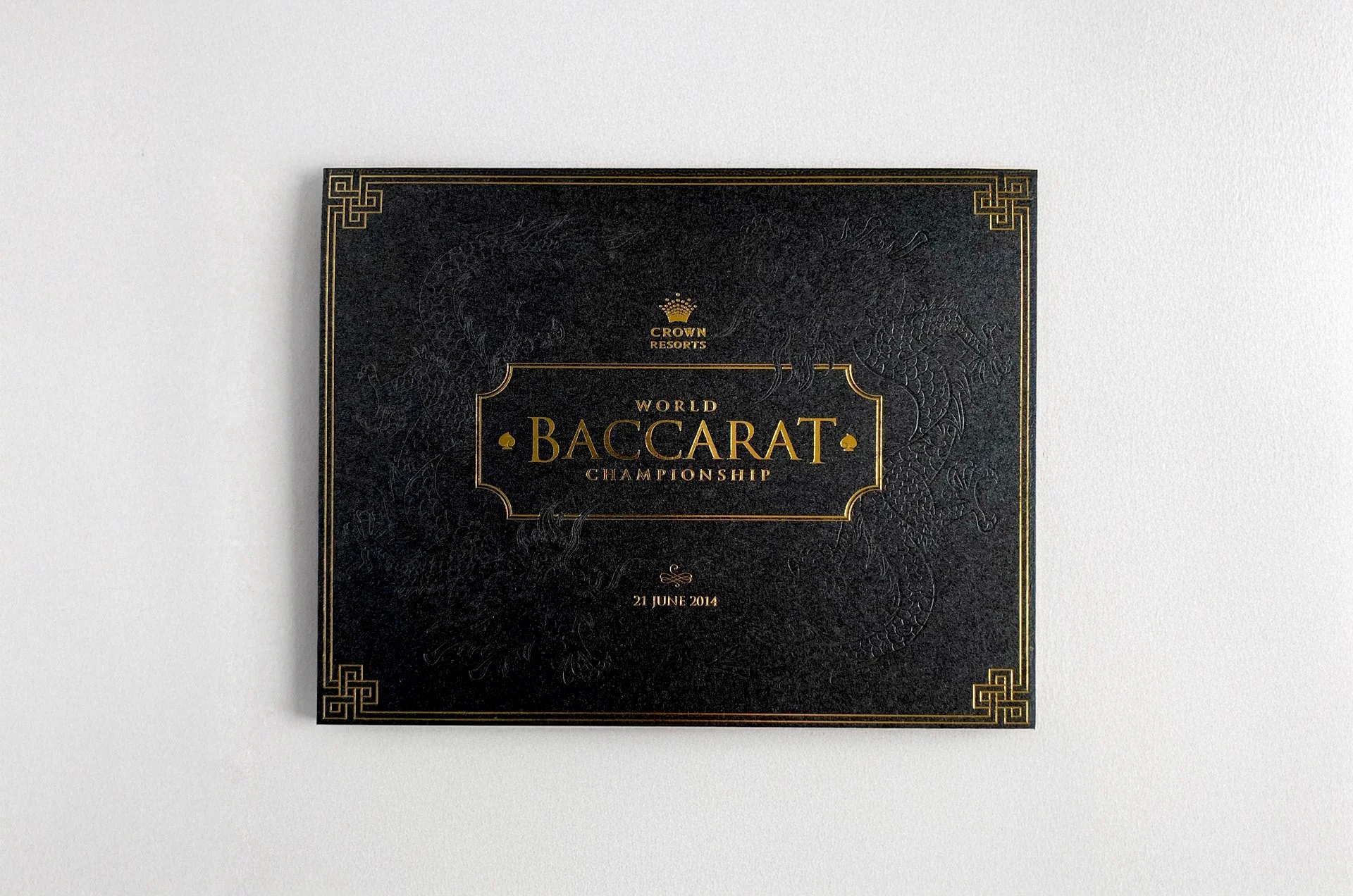 Two foils are utilised on the cover: gold for the lettering and border features, and a clear foil for the dragons. An uncoated paper stock coupled with foil stamping allows for the design to contrast.