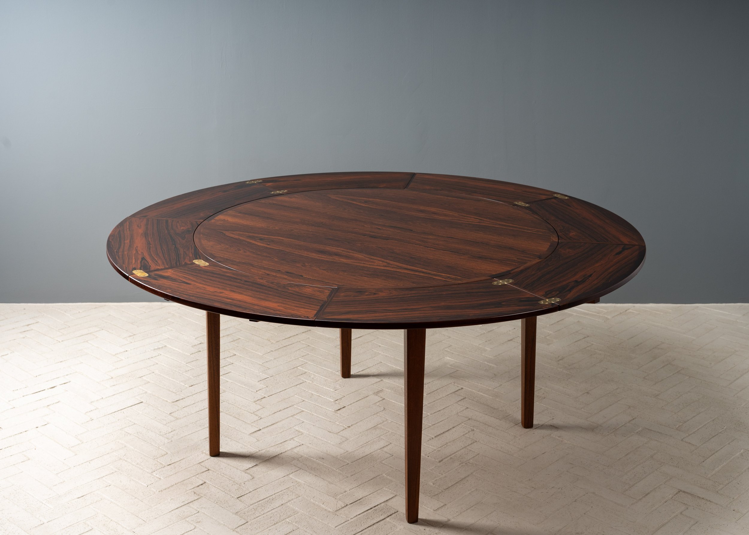 dyrlund-rosewood-round-flip-flap-dining-table-resideinc-19.jpg