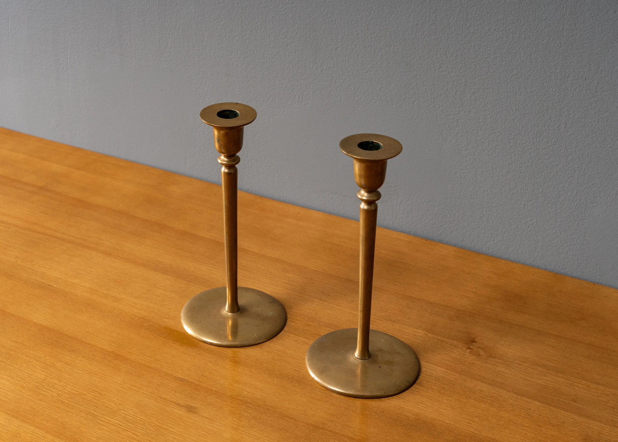 pair-of-brass-candlestick-holders-reside-inc-2.jpg