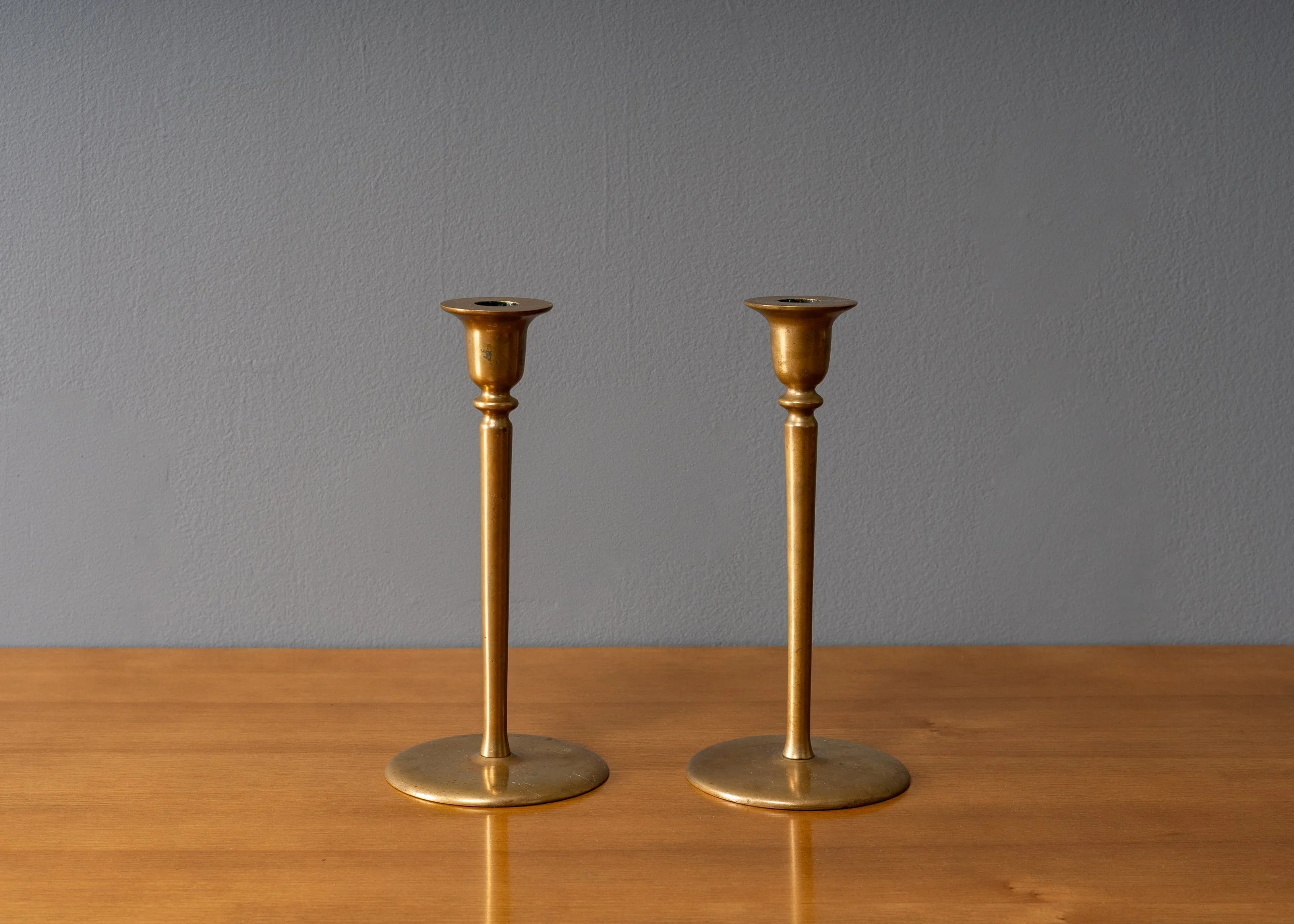 pair-of-brass-candlestick-holders-reside-inc-1.jpg