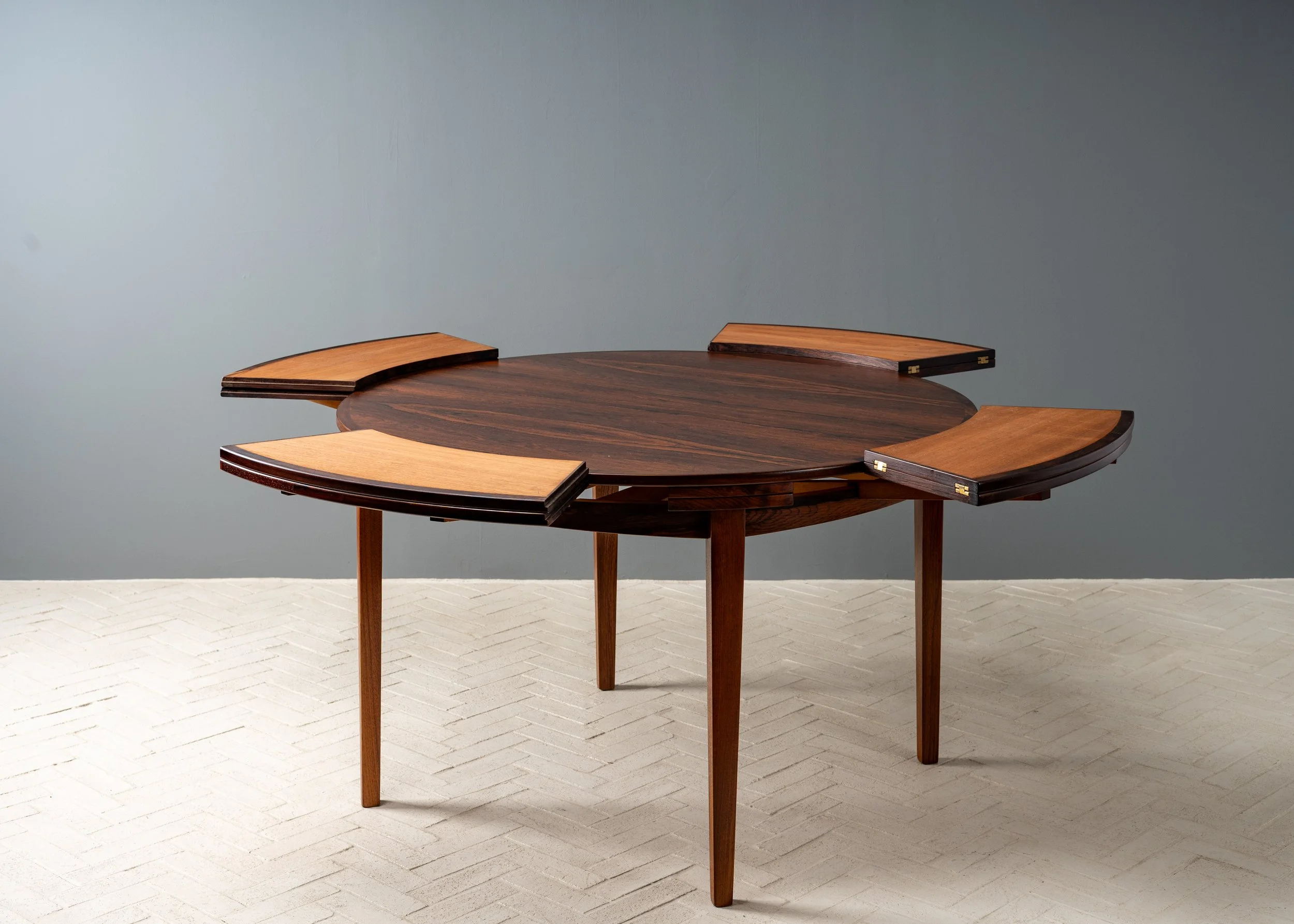 dyrlund-rosewood-round-flip-flap-dining-table-resideinc-16.jpg