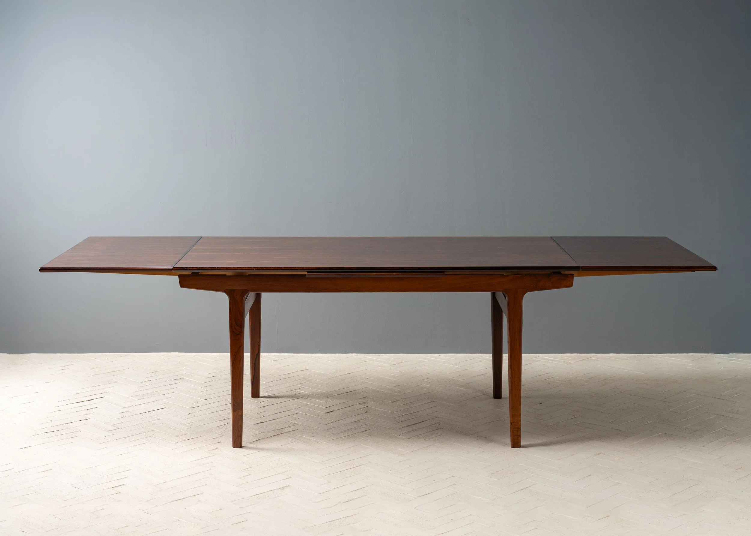 henning-kjaernulf-rosewood-dining-table-resideinc-3.jpg