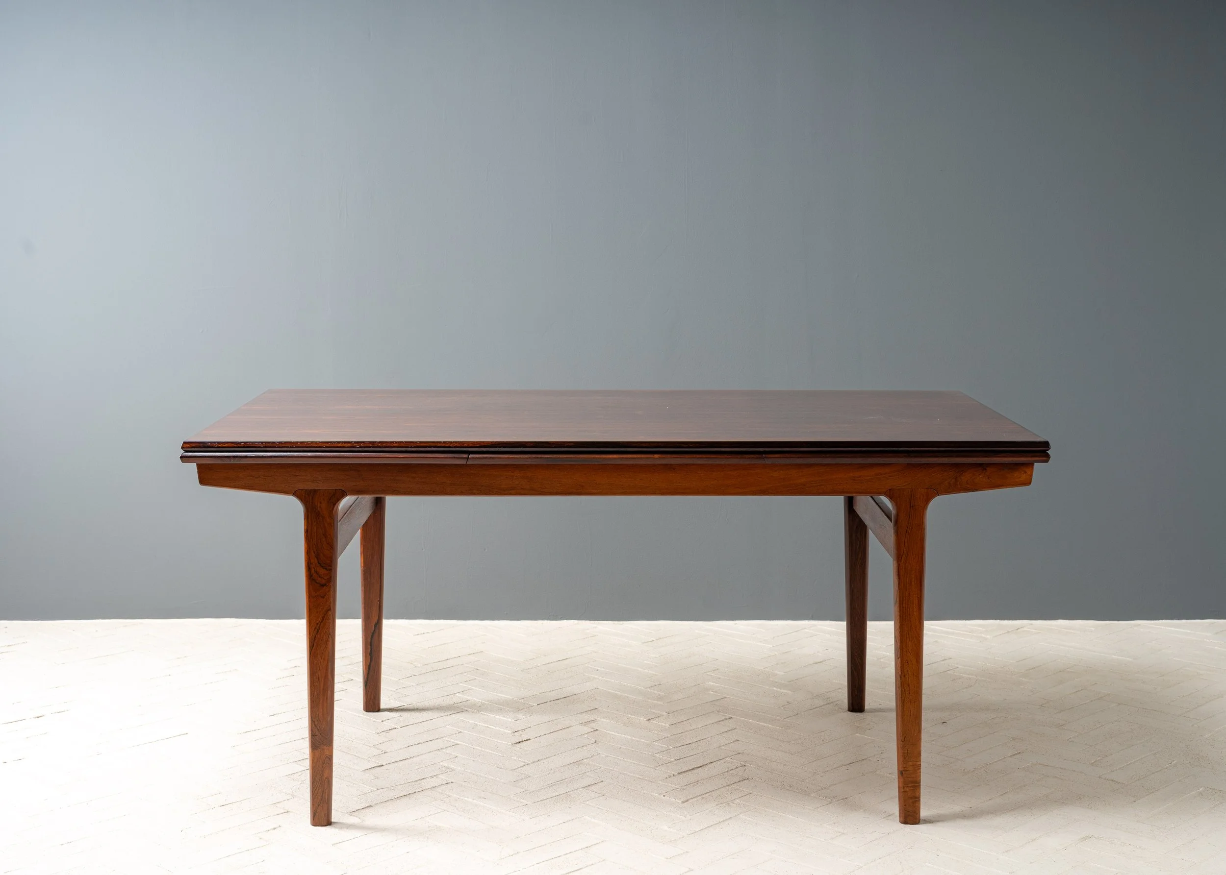 henning-kjaernulf-rosewood-dining-table-resideinc-1.jpg