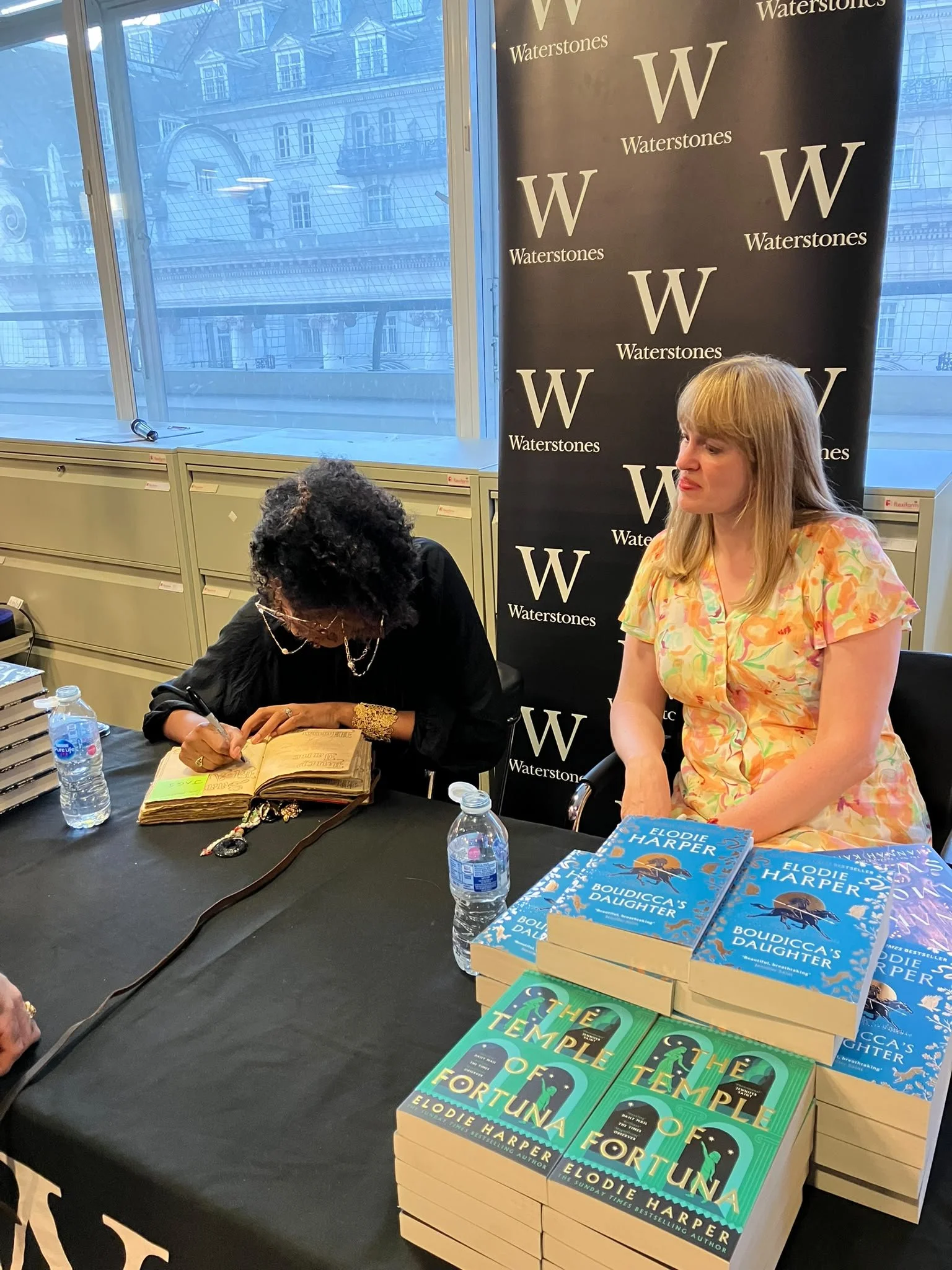 Elodie and Saara signing.jpeg