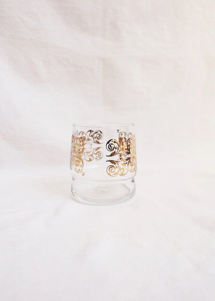 Glass cup with golden stencil detail