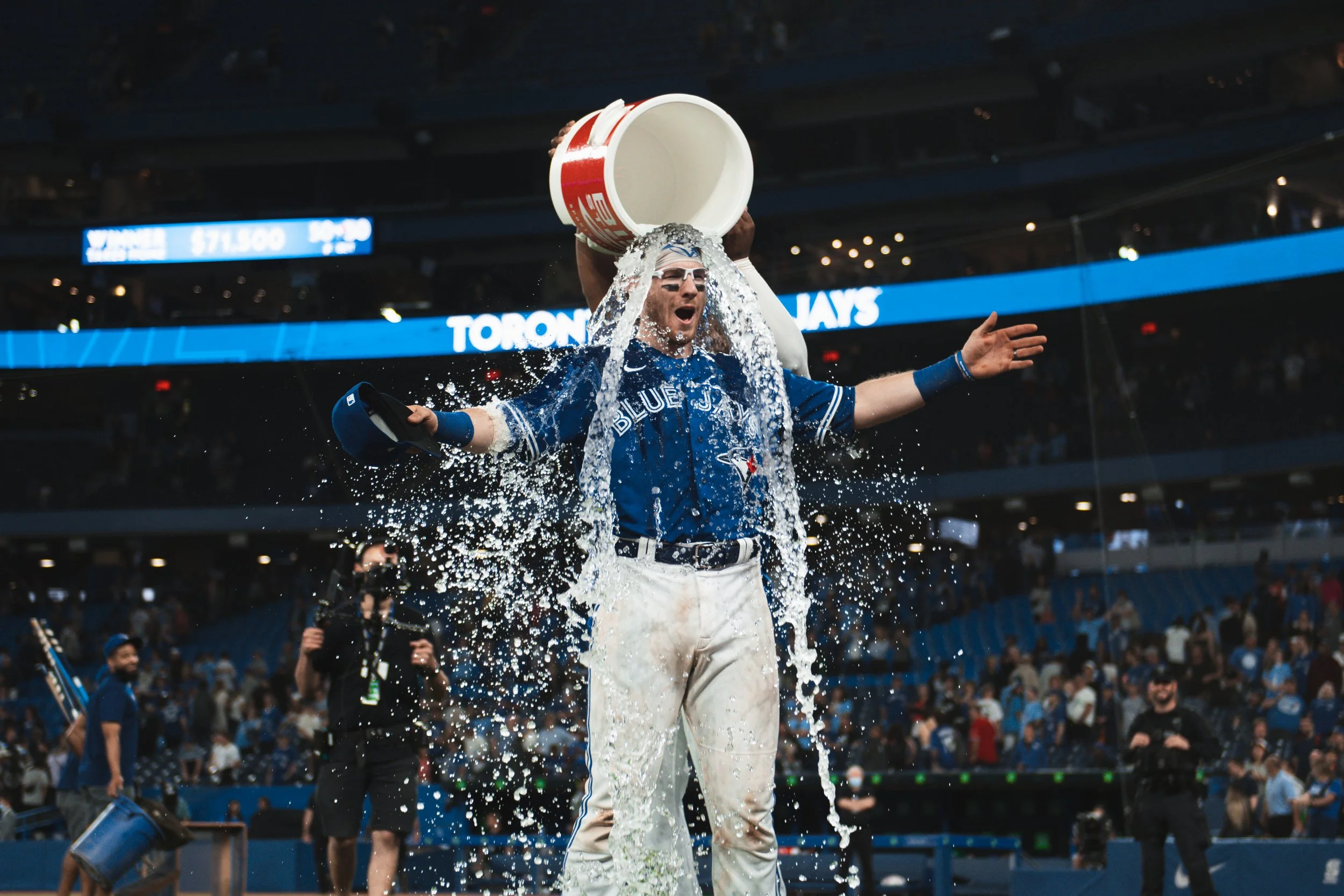 Toronto Blue Jays' catcher Danny Jansen reacts to being showered in Biosteel after a 7-3 win vs. the Chicago White Sox. Jansen went 1-3 with a three-run home run. June 1, 2022. (Kaj Larsen Photo)