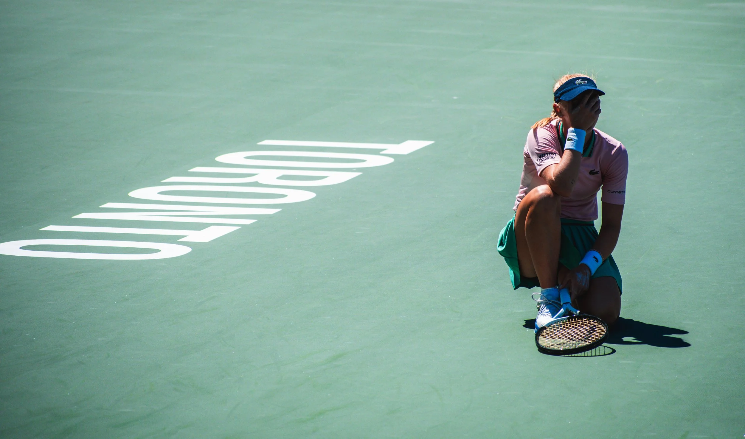 Swiss tennis player Jil Teichmann facepalms after failing to return a shot in her Round of 16 loss to Simona Halep at the National Bank Open. August 11, 2022. (Kaj Larsen Photo for Tennis Canada)