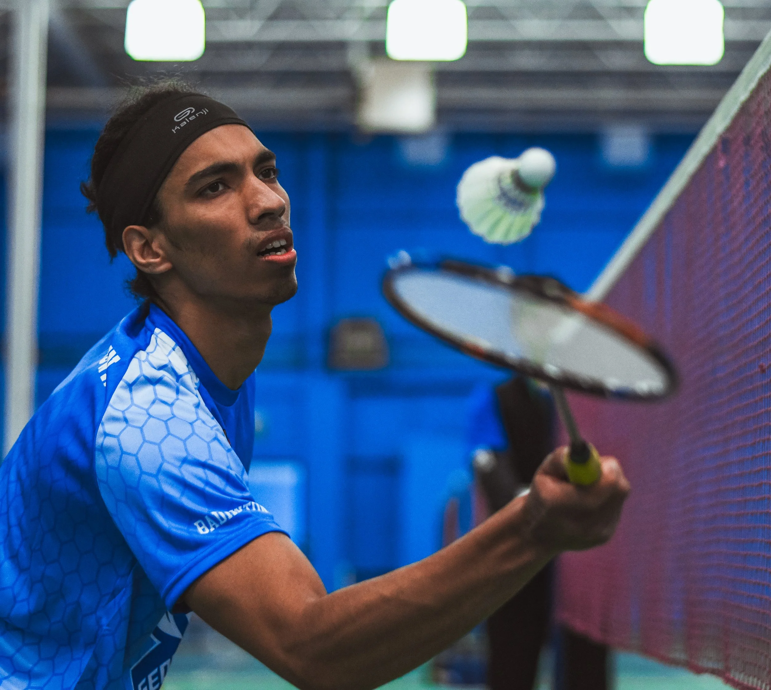 A George Brown badminton player returns a net-front shot during tournament play during the Ontario Championships. March 4, 2022. (Kaj Larsen Photo for George Brown College)