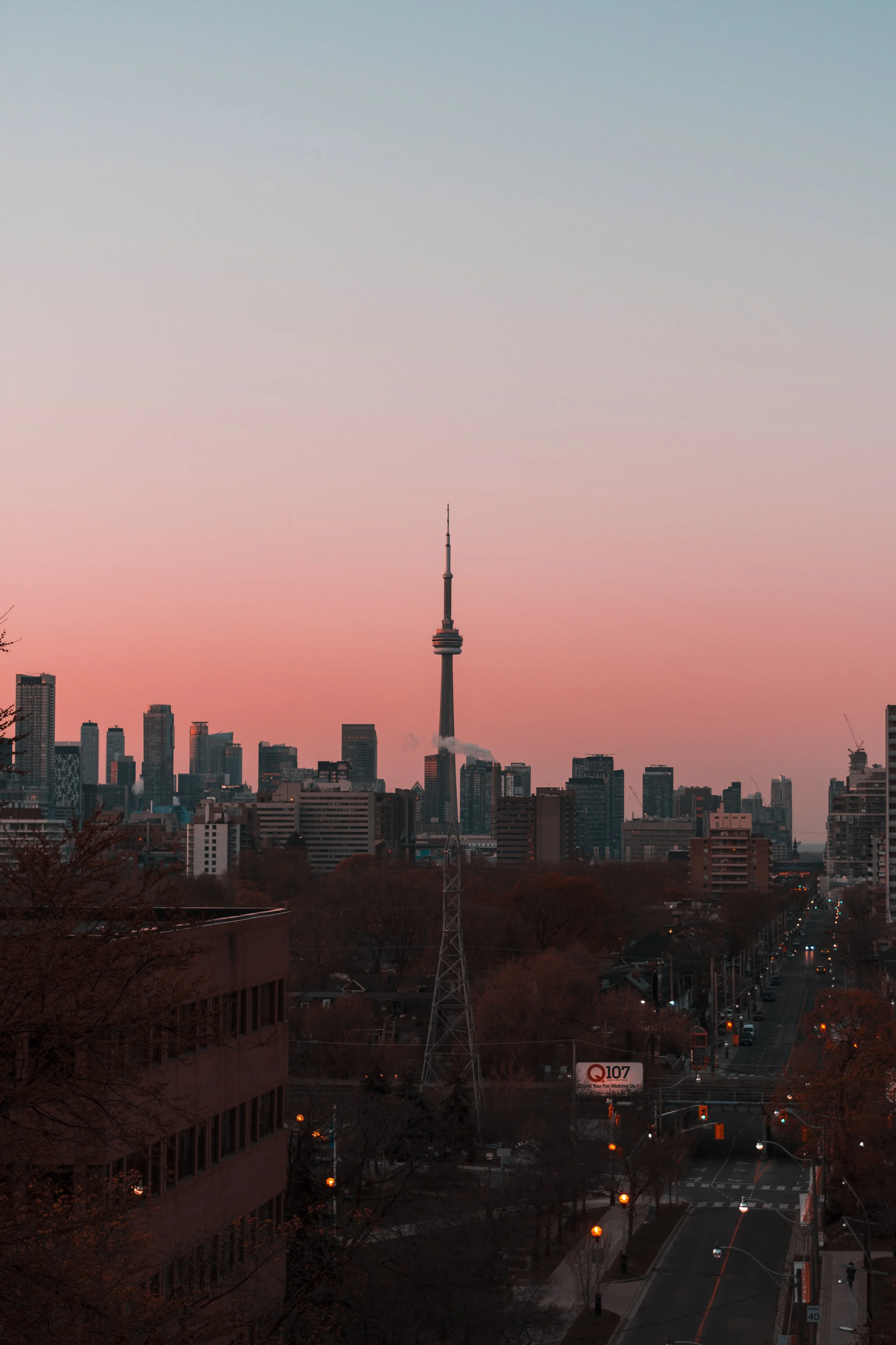 A pink sky looms over the Toronto skyline during sunrise. April 23, 2021. (Kaj Larsen photo)