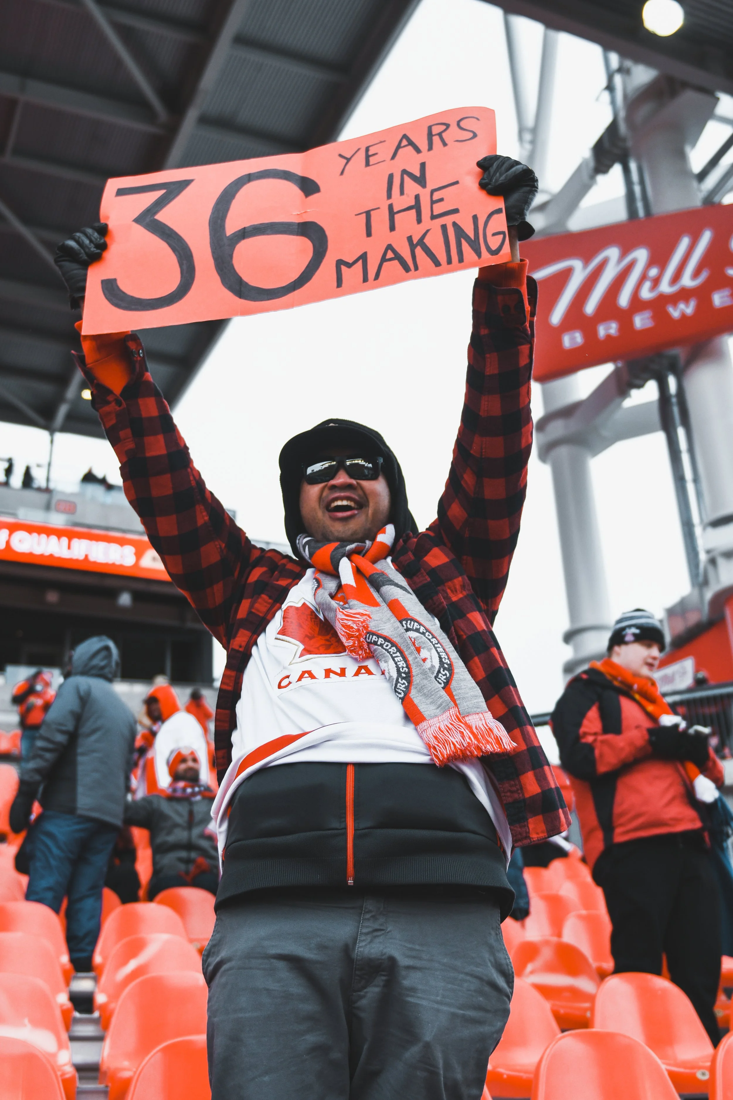 A fan holds up a sign with the number of years since the last time the Canadian Men's national soccer team qualified for the World Cup ahead of their qualifying match. Canada went on to defeat Jamaica 4-0 and qualify for the World Cup for the first t