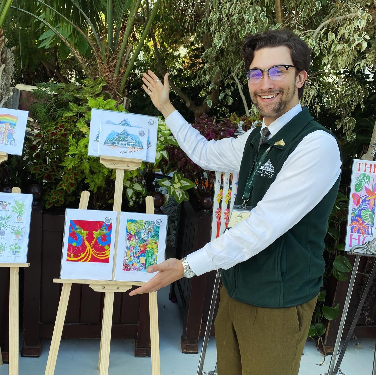 A fresh stock drop has landed at @seftonparkpalmhouse after a busy month of sales, new prints, Christmas cards, and BRAND NEW mugs! Pop in, say hello to Adam (modelling the work so wonderfully) and check out all the lovely new work on offer 🪴