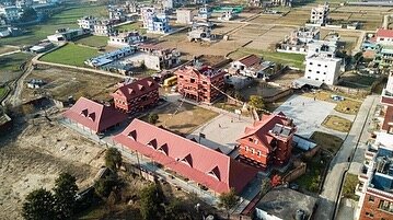 How's this for a change of perspective? 👀

We love these birdseye shots of Kailash Home. 🏘 The long red-roofed buildings on the left side of the courtyard are the newest additions to campus -- the gathering hall/kitchen &amp; library. 
#KailashHome