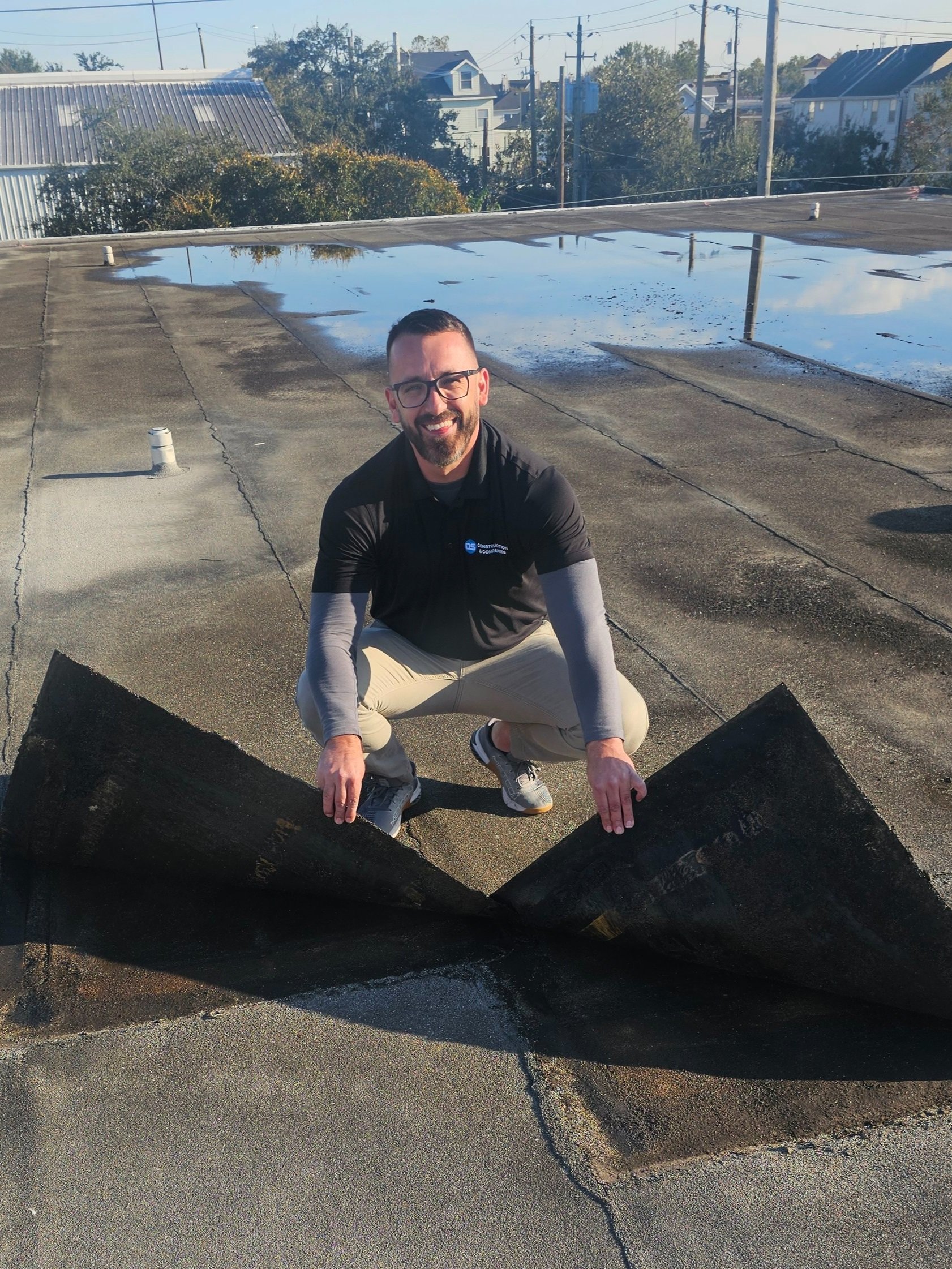 Roofing superintendent carrying out an inspection.