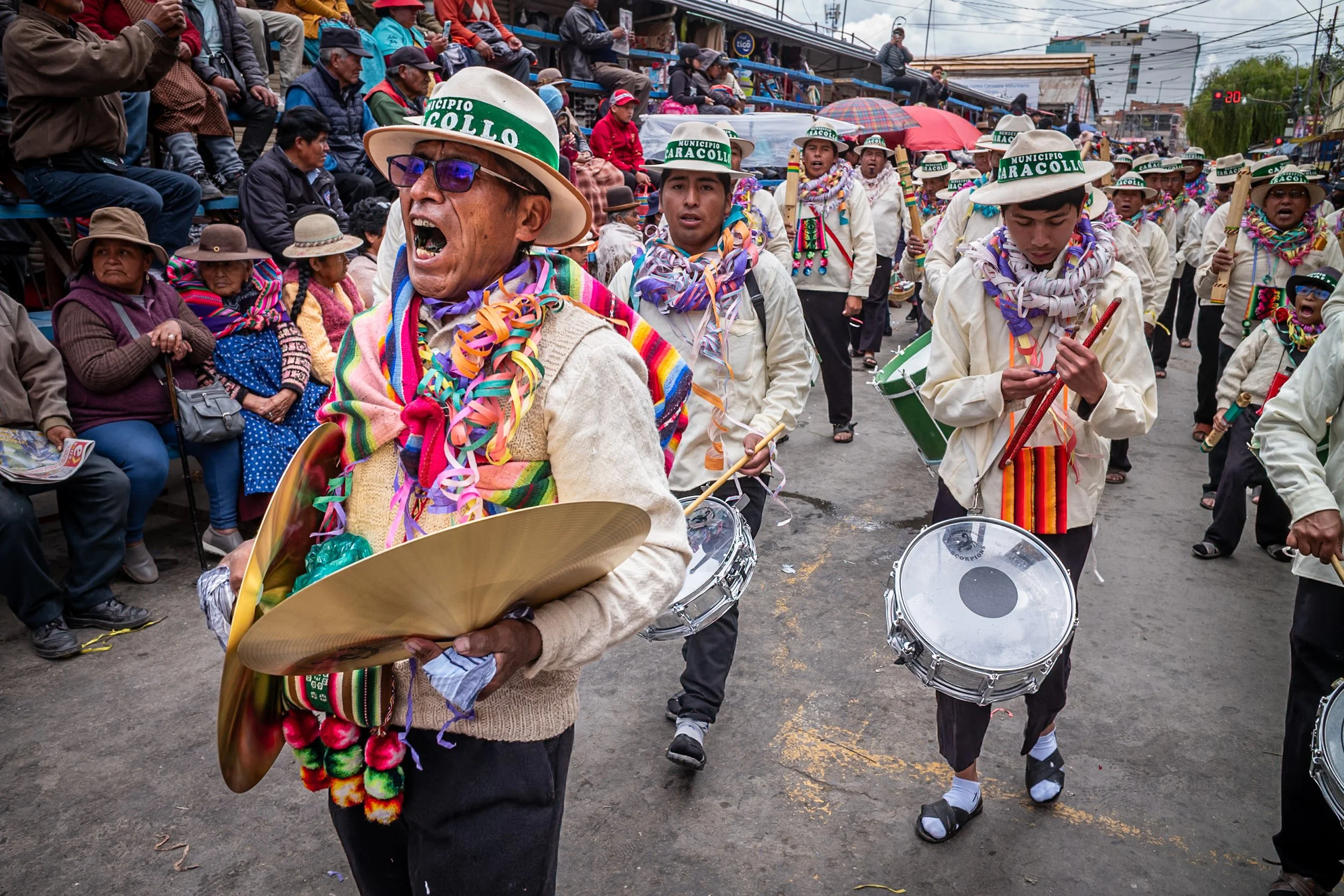 Musician singing during Andean Anata