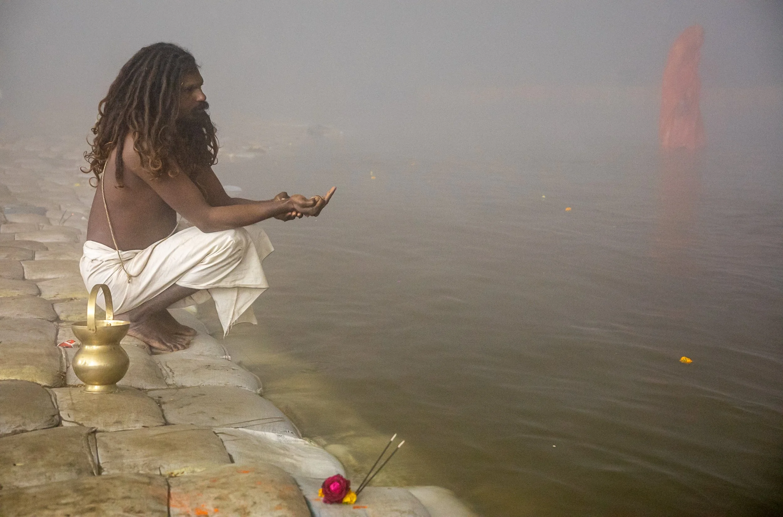 Sadhu praying on Ganges bank in Allahabad