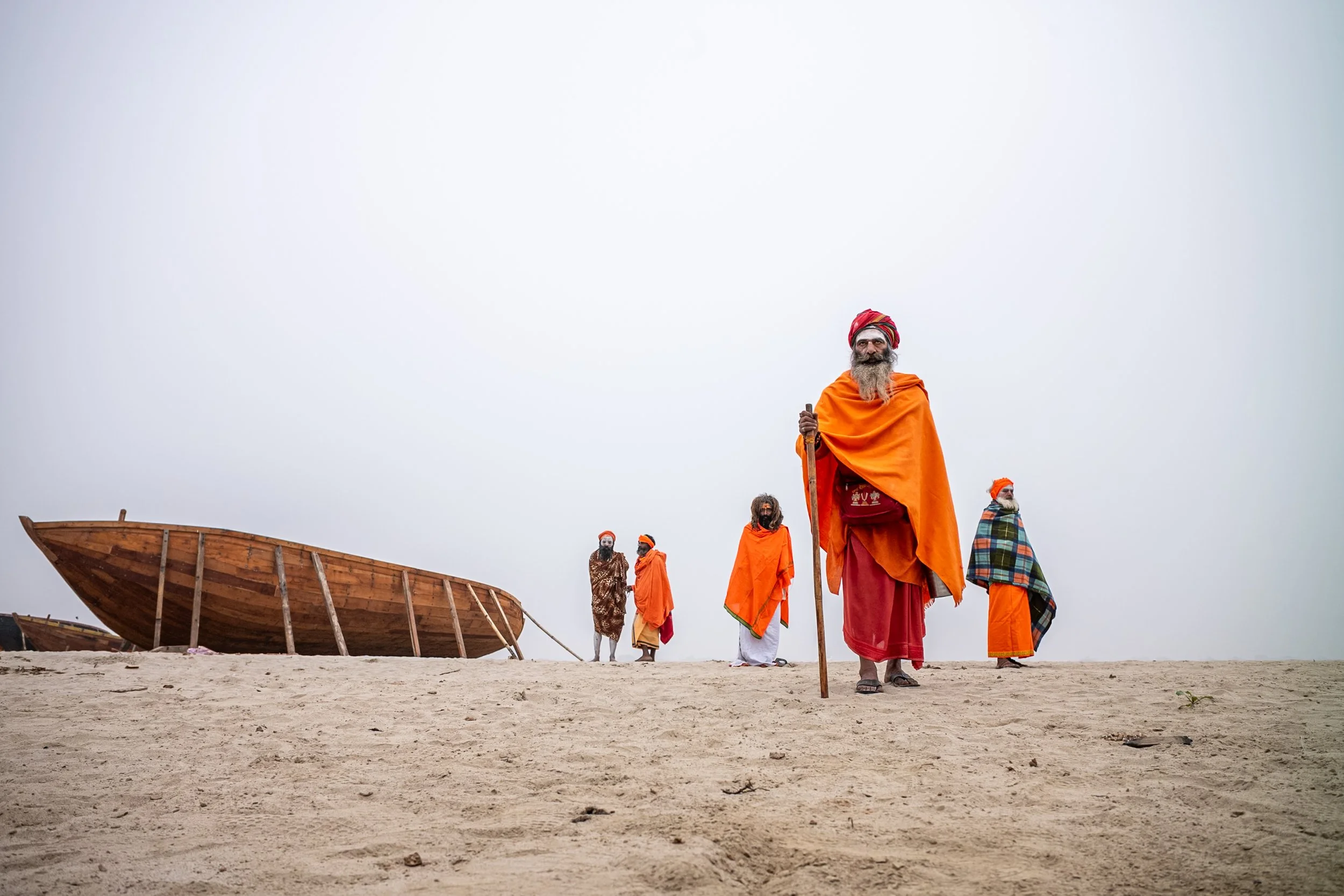 Sadhus in Varanasi desert bank with boat