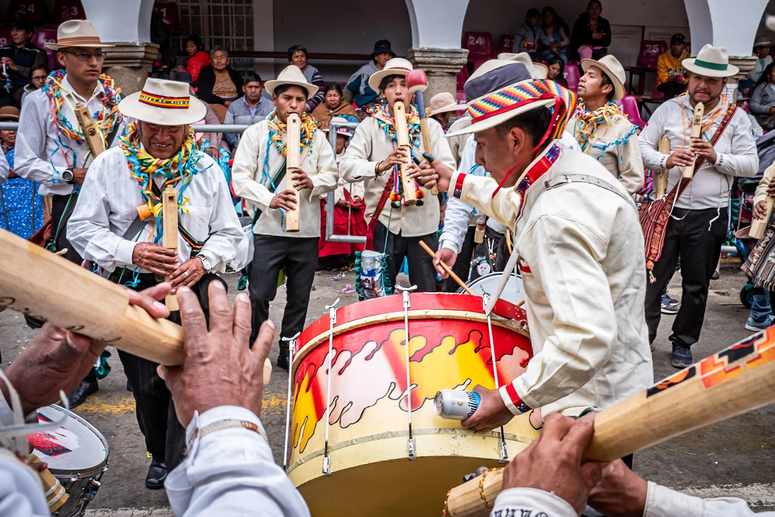 Musicians in white playing during Andean Anata