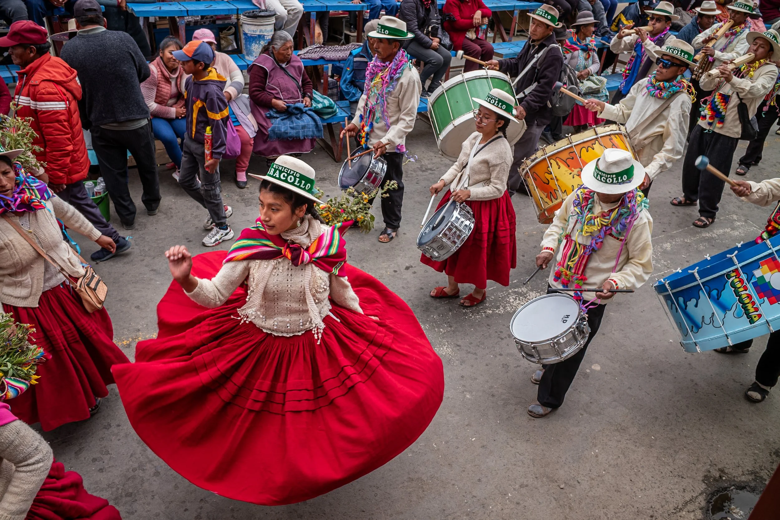 Girl twirling red skirt during Andean Anata