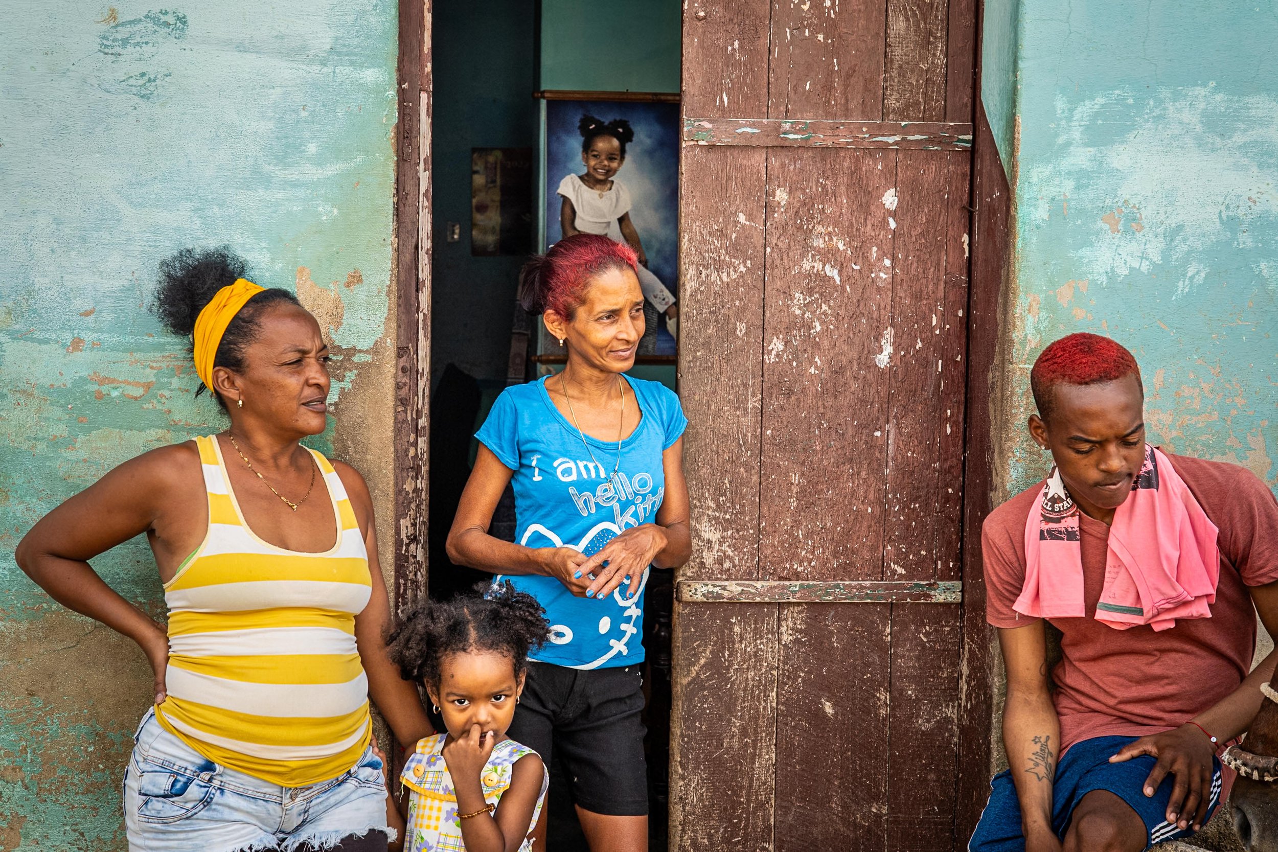 Girl and her portrait on the wall in Trinidad